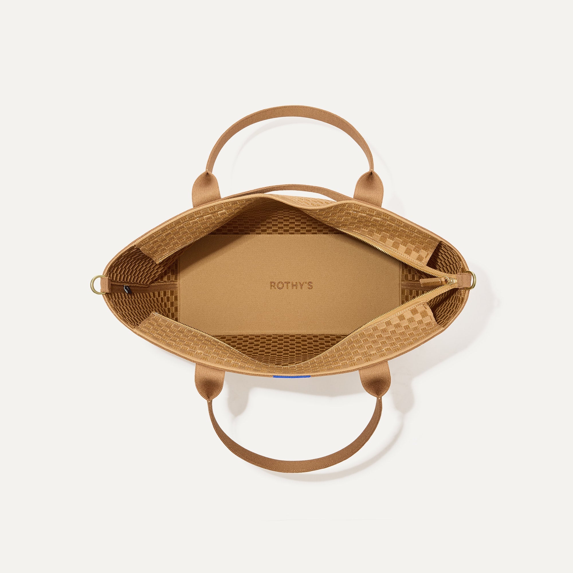The Zip Travel Tote, shown from above with the interior exposed.