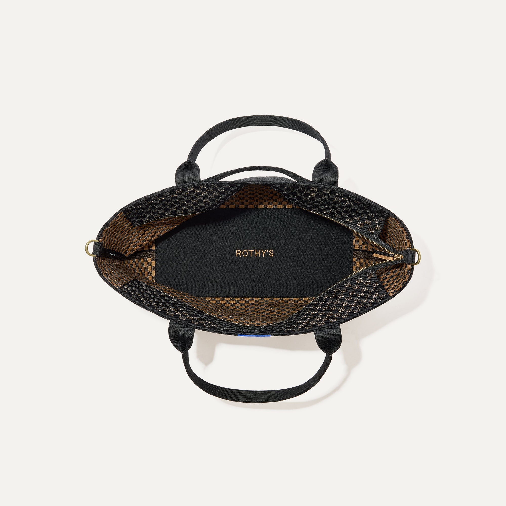 The Zip Travel Tote, shown from above with the interior exposed.