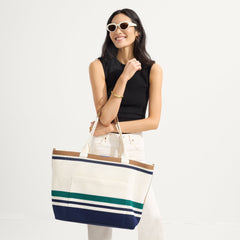 hover | Model holding The Zip Travel Tote in Volley.