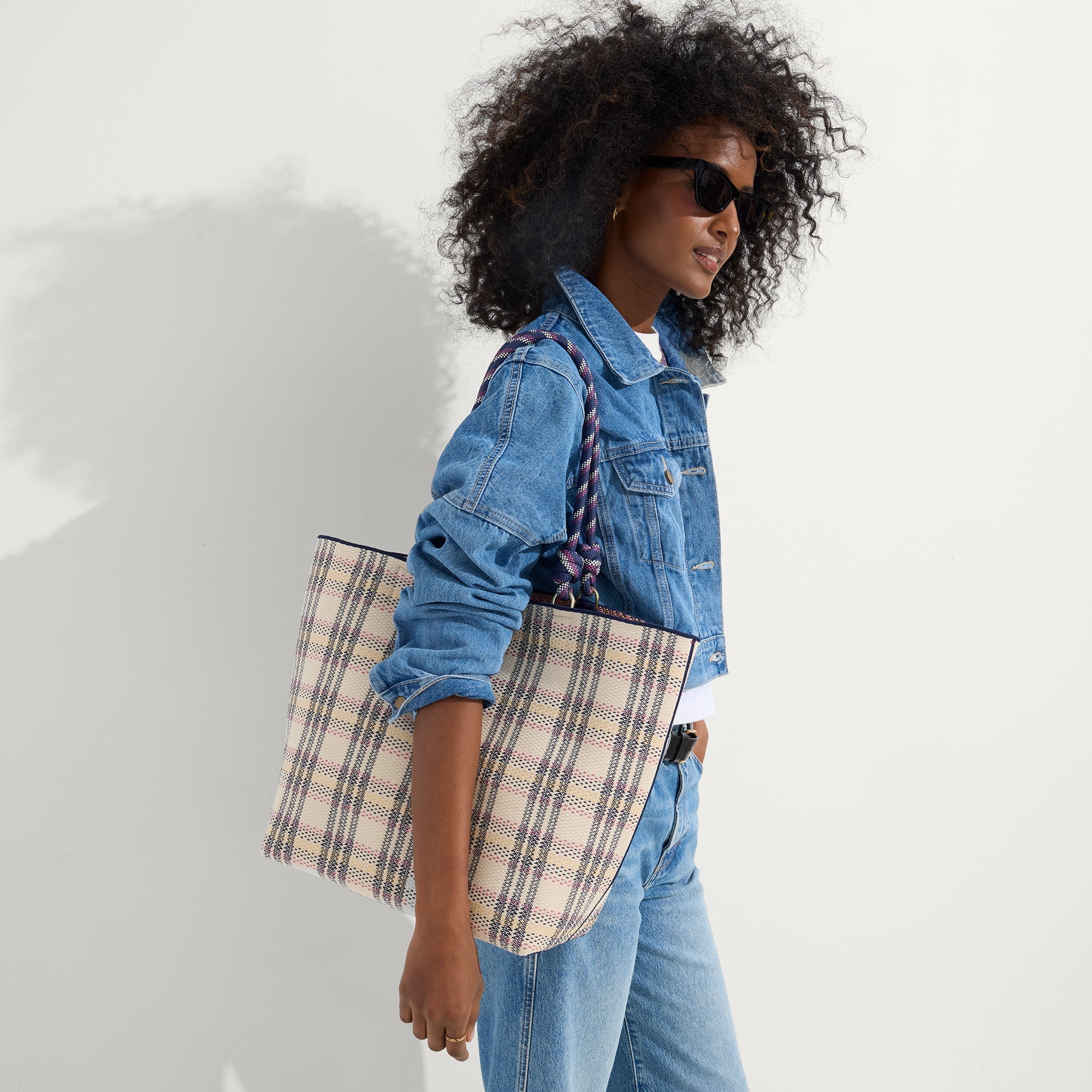 hover | Model holding The Lightweight Tote in Spring Plaid.