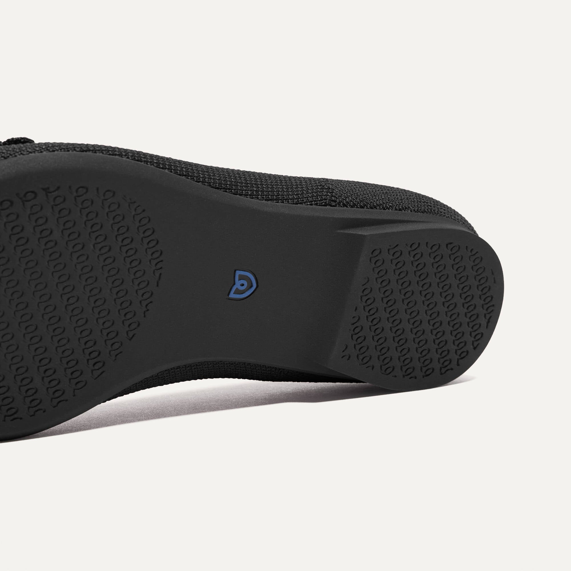 The sole of The Petal Point II in Black shown in diagonal view.