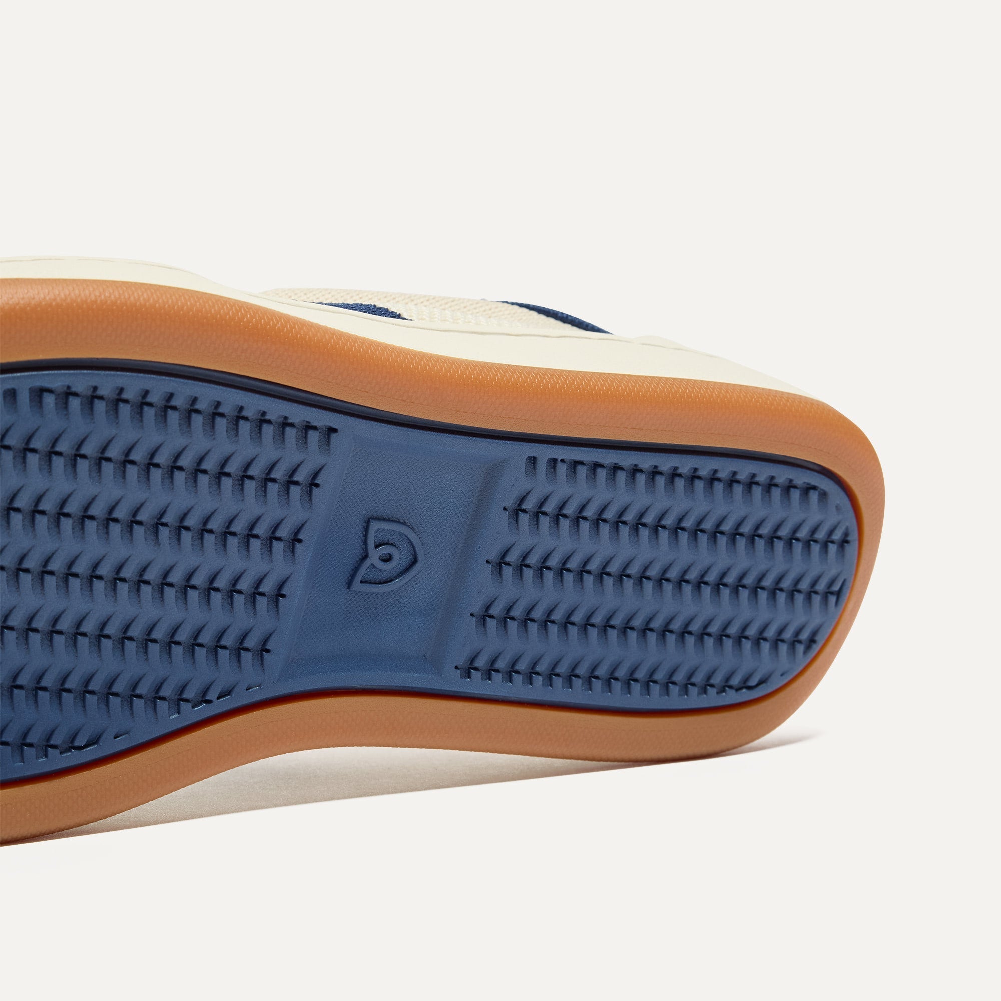 Close up of the outsoles of The Men's Court Sneaker in Freestyle.