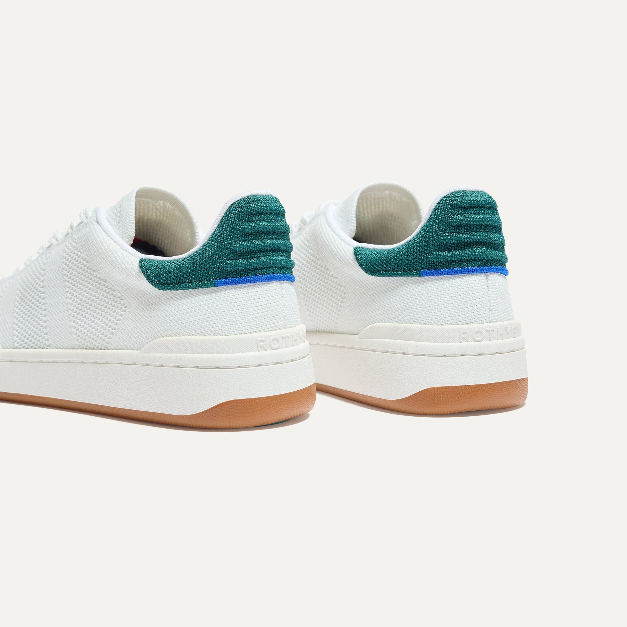 Close up of the heel of The Men's Court Sneaker in Turf, with Rothy's signature blue halo. 