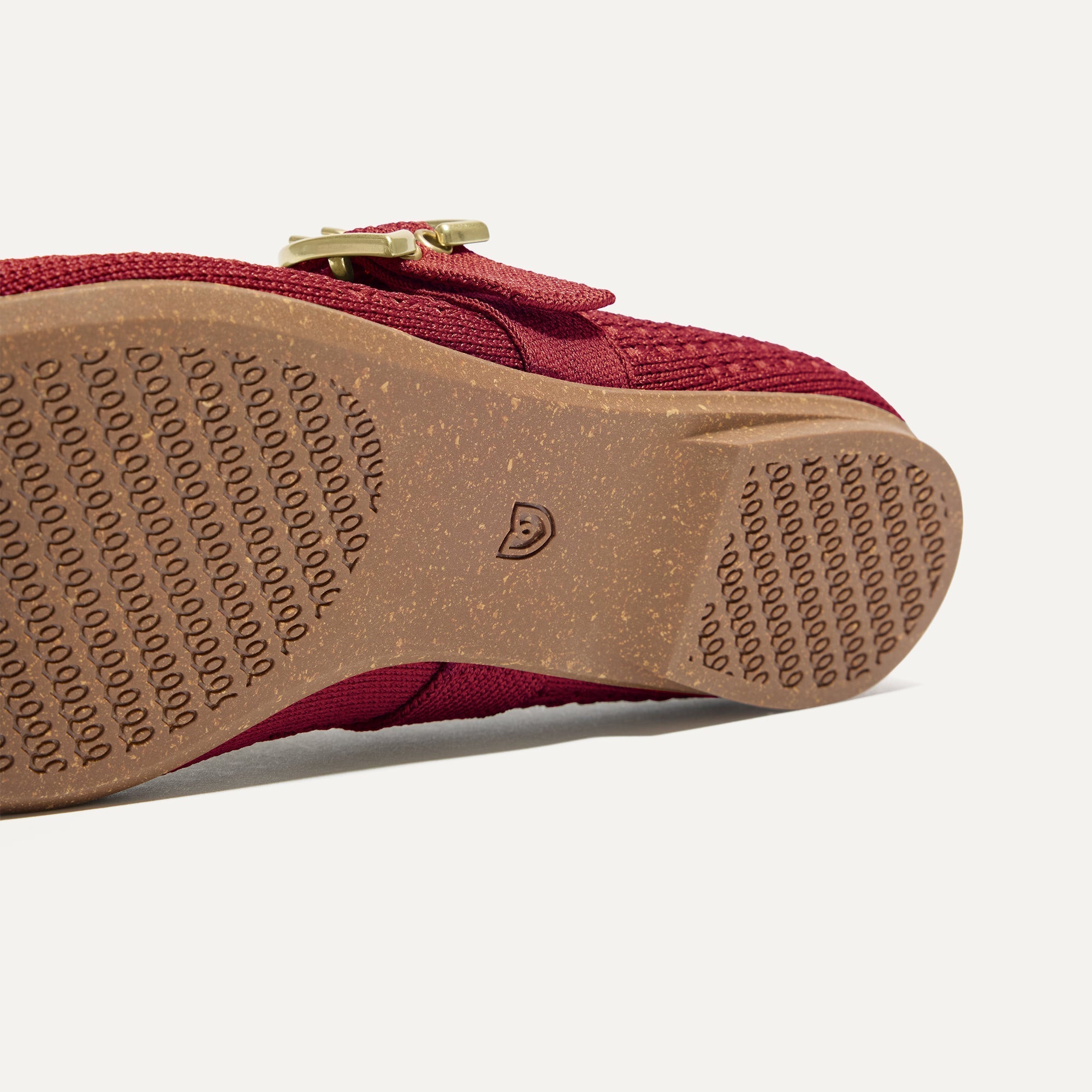 The sole of The Max Buckle Mary Jane in Ruby Mesh.