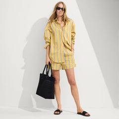 Model holding The Lightweight Tote in Black Crochet.