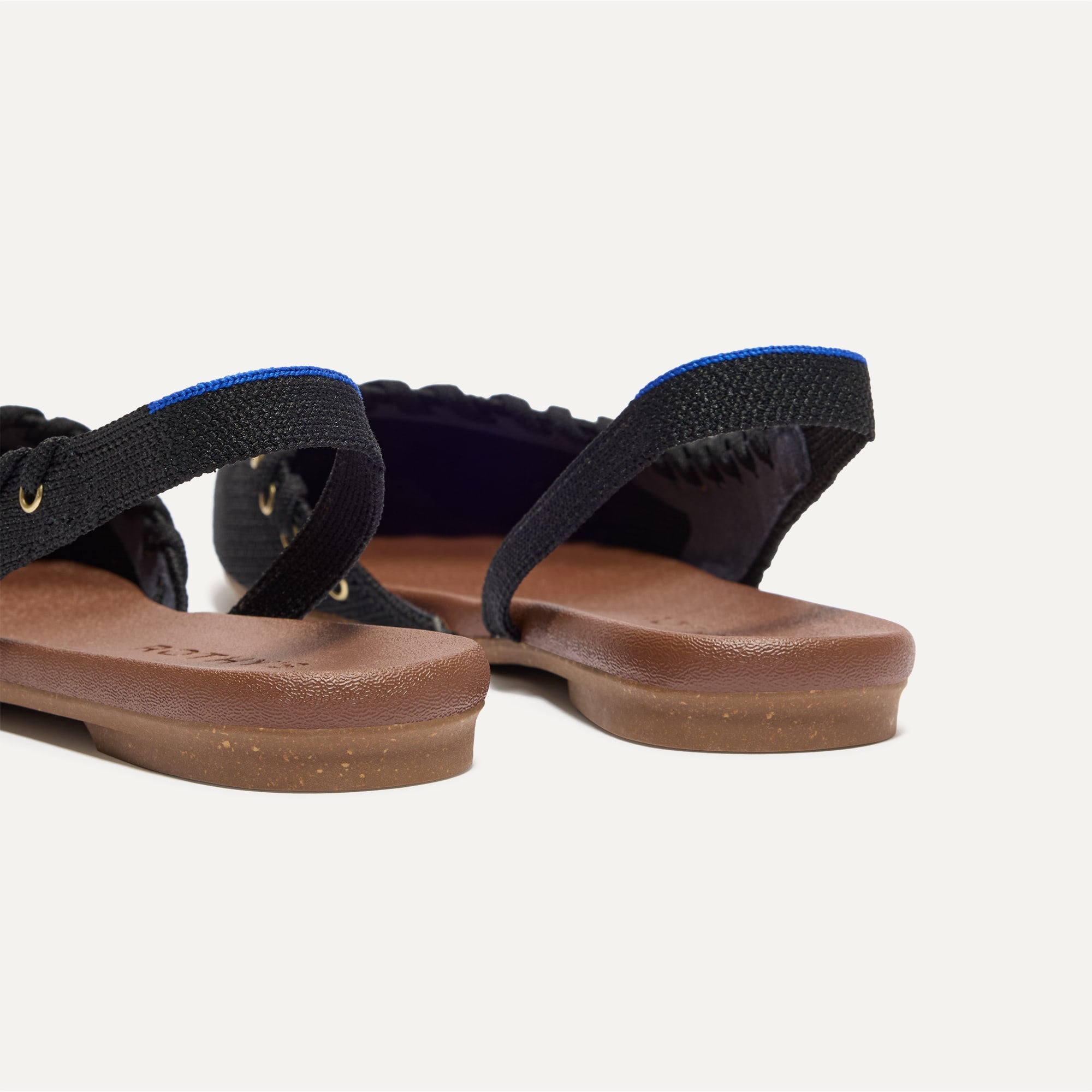 Close up of the heel The Almond Slingback in Eyelet Black.