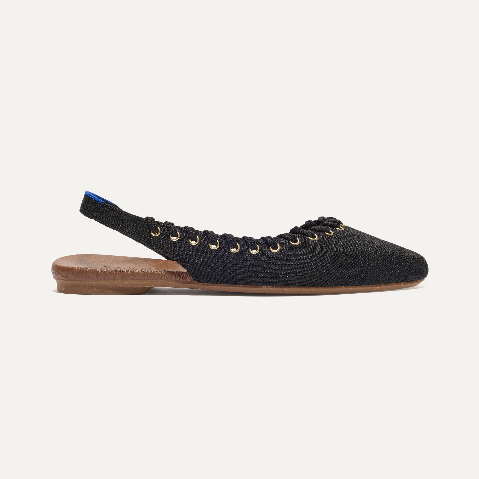 Side view of The Almond Slingback in Eyelet Black.
