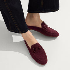 hover | Model wearing The Double Bit Loafer Mule in ReVelvet™ Syrah.