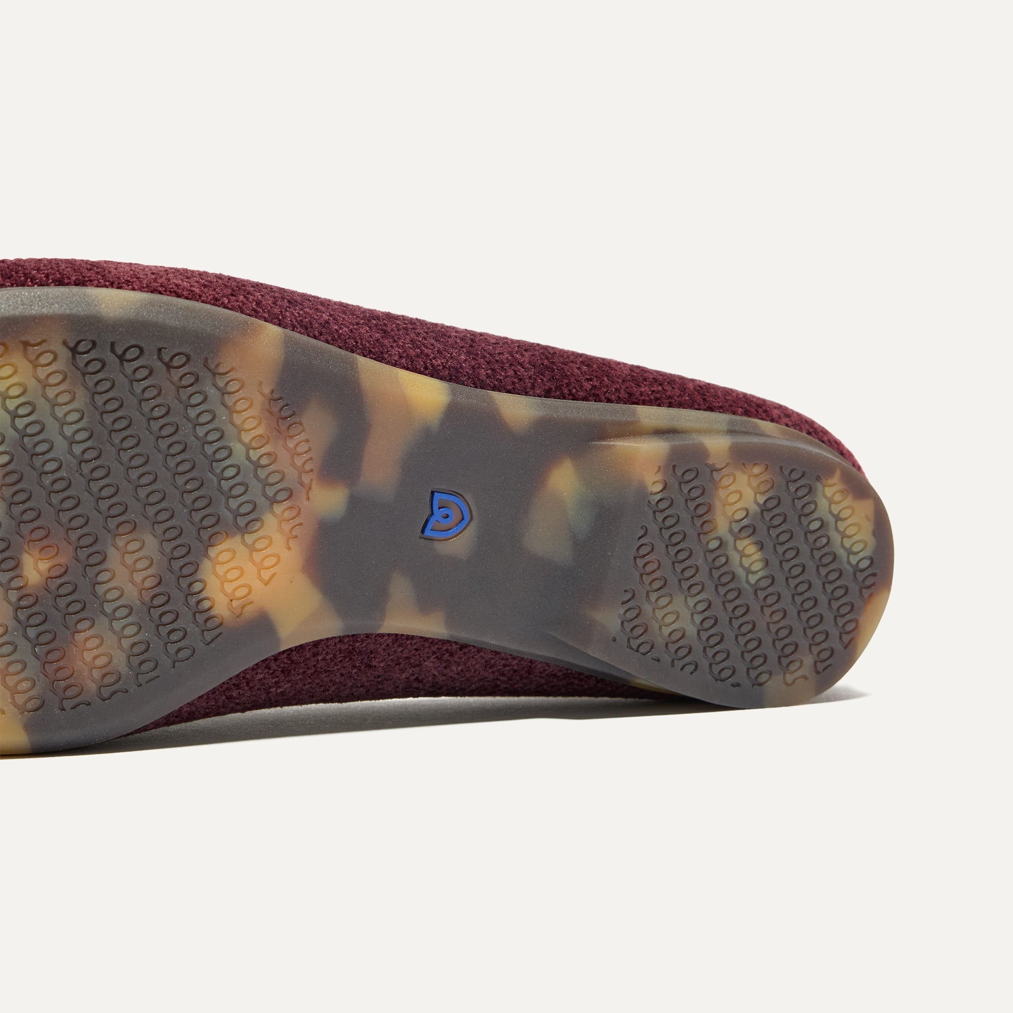 Close up of the outsoles of The Double Bit Loafer Mule in ReVelvet™ Syrah.