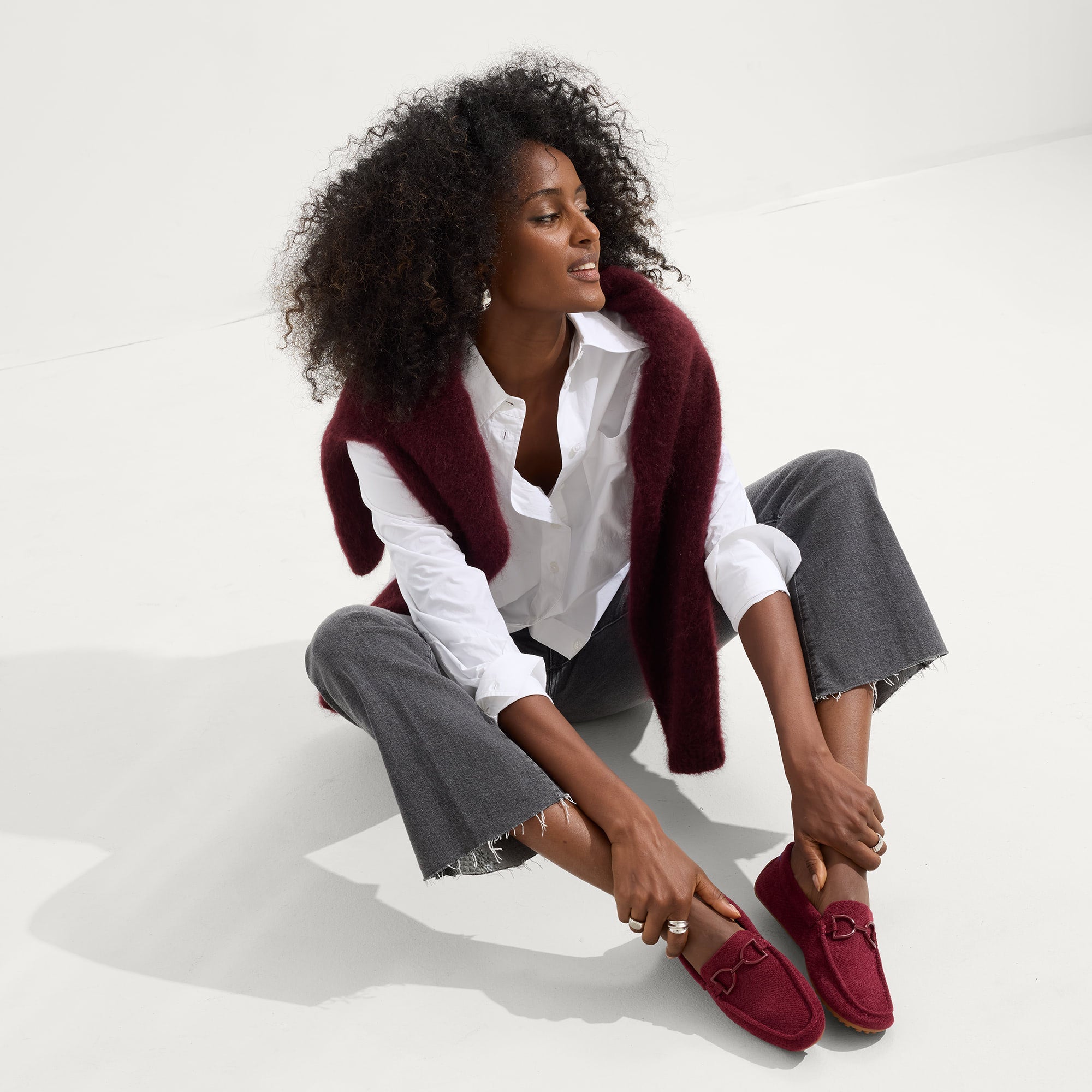 Alternate view of a model wearing The Double Bit Driver in ReVelvet™ Cabernet.