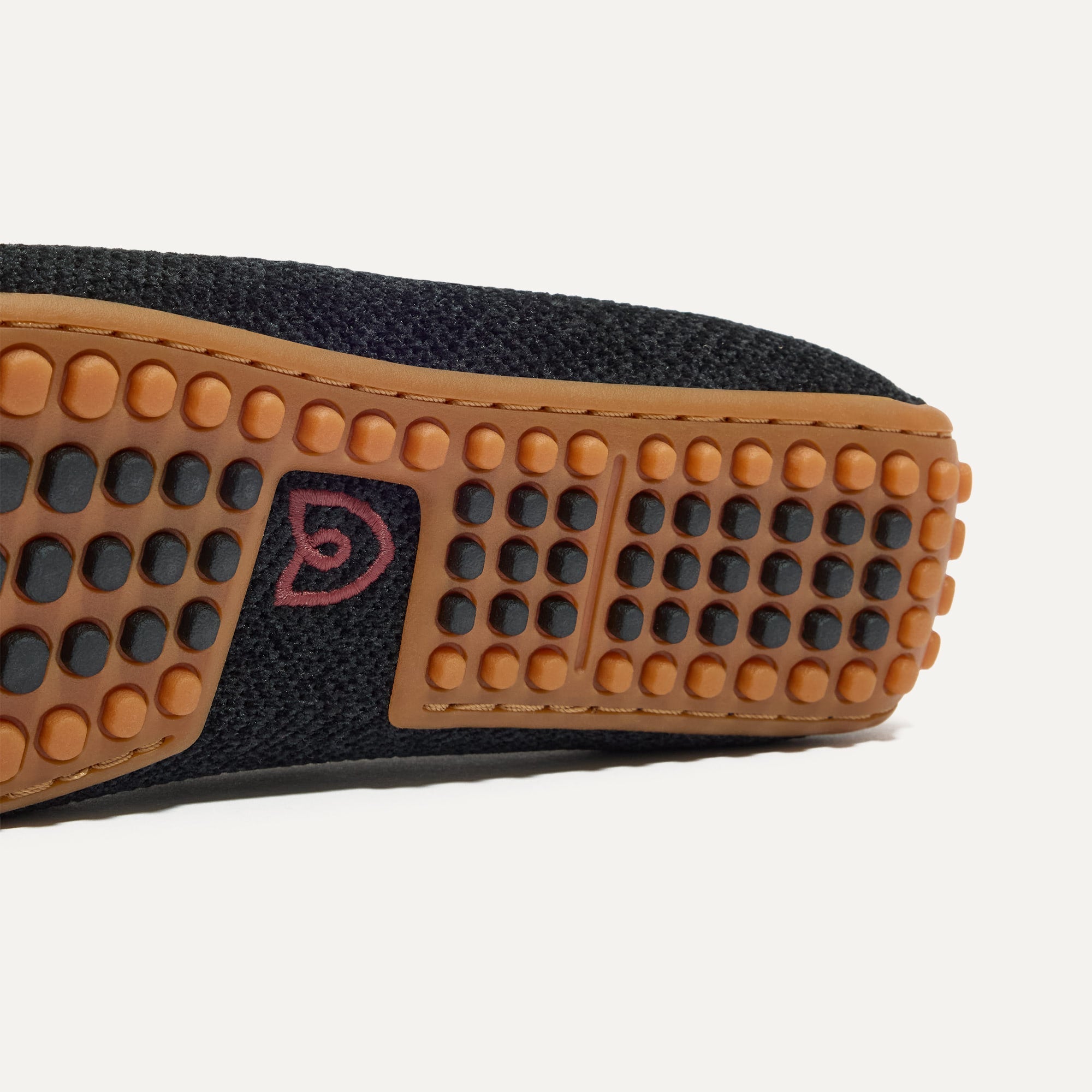 Close up of the raised nub outsoles of The Double Bit Driver in ReVelvet™ Black.