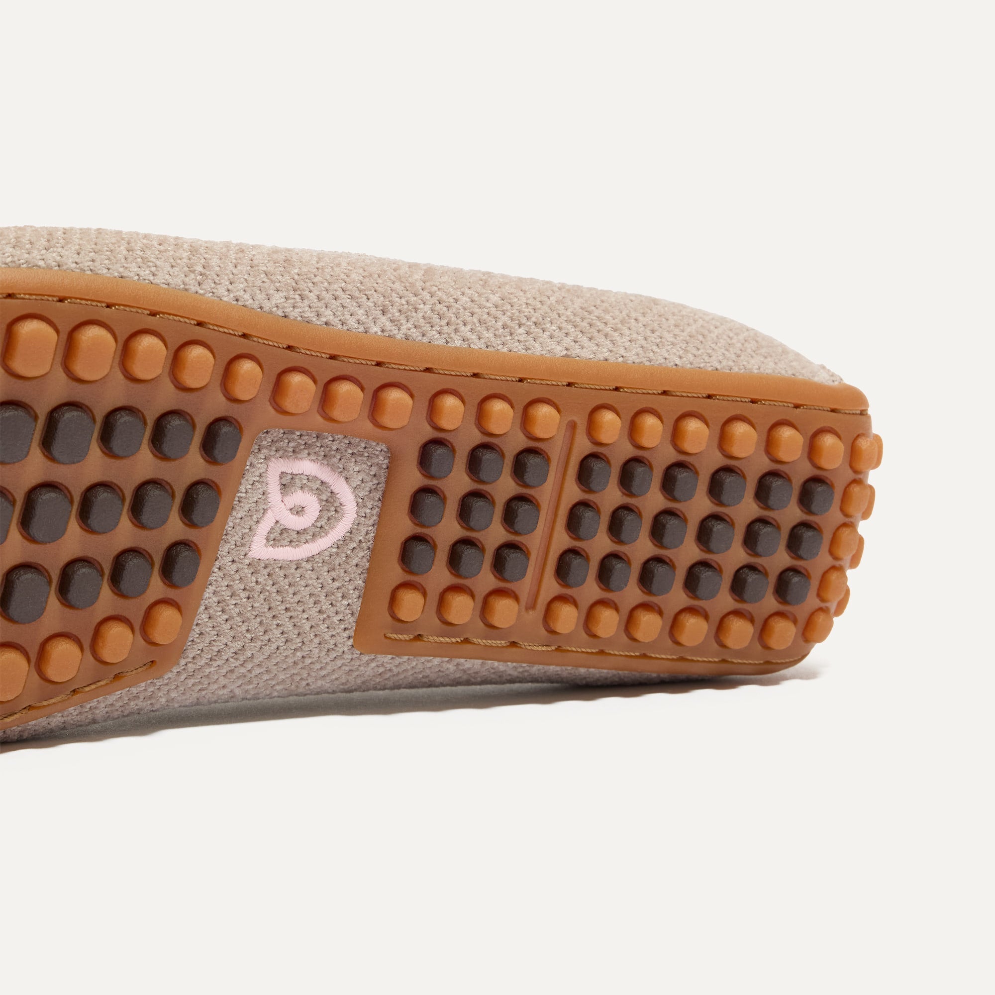 Close up of the raised nub outsoles of The Double Bit Driver in ReVelvet™ Dove.