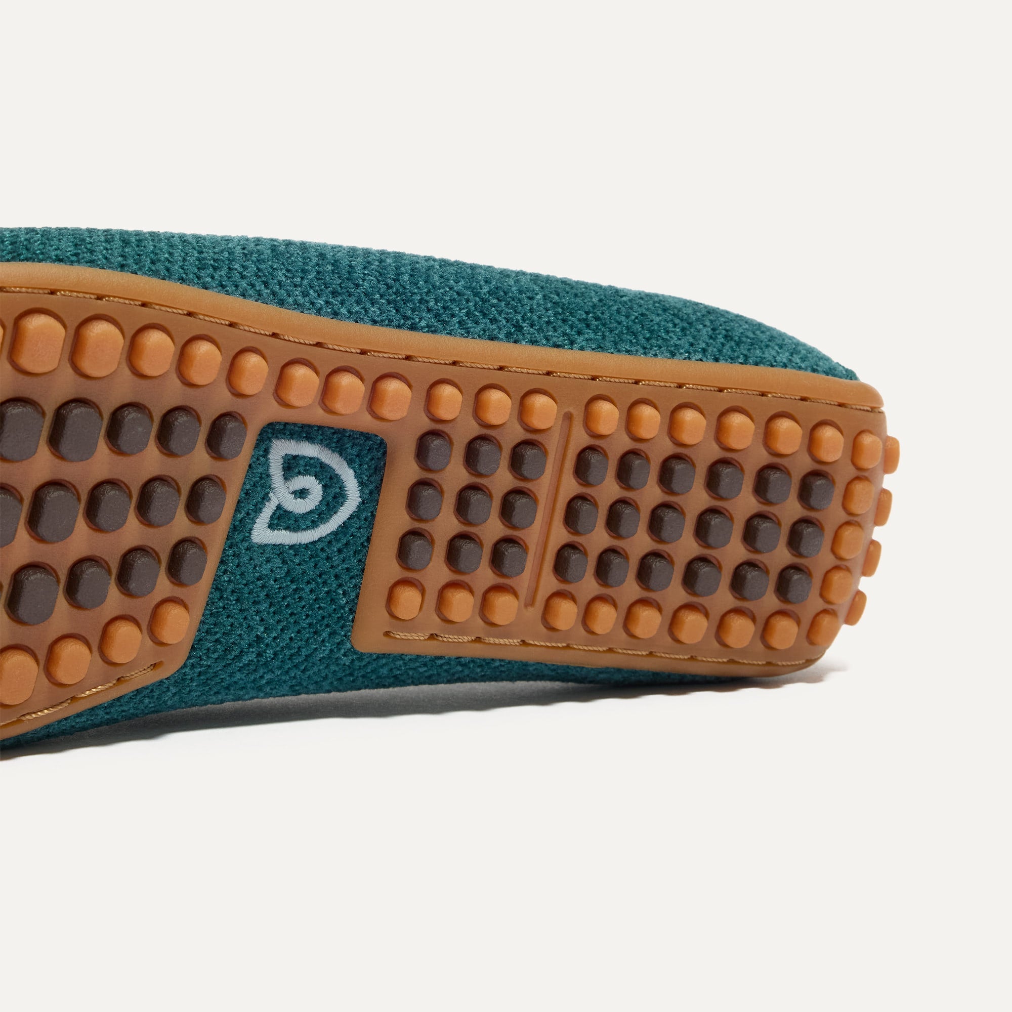 Close up of the raised nub outsoles of The Double Bit Driver in ReVelvet™ Everglade.