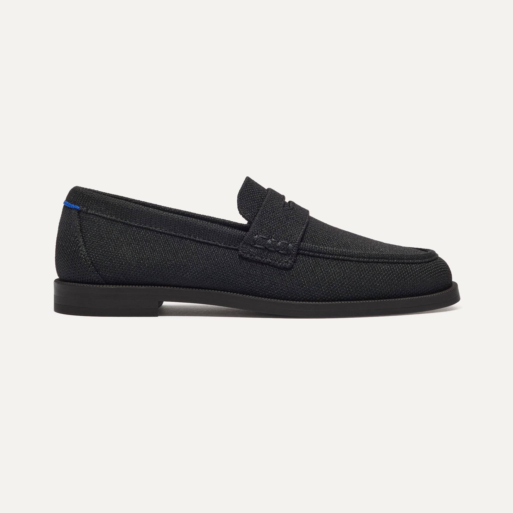 The Penny Loafer in Black shown from the side.