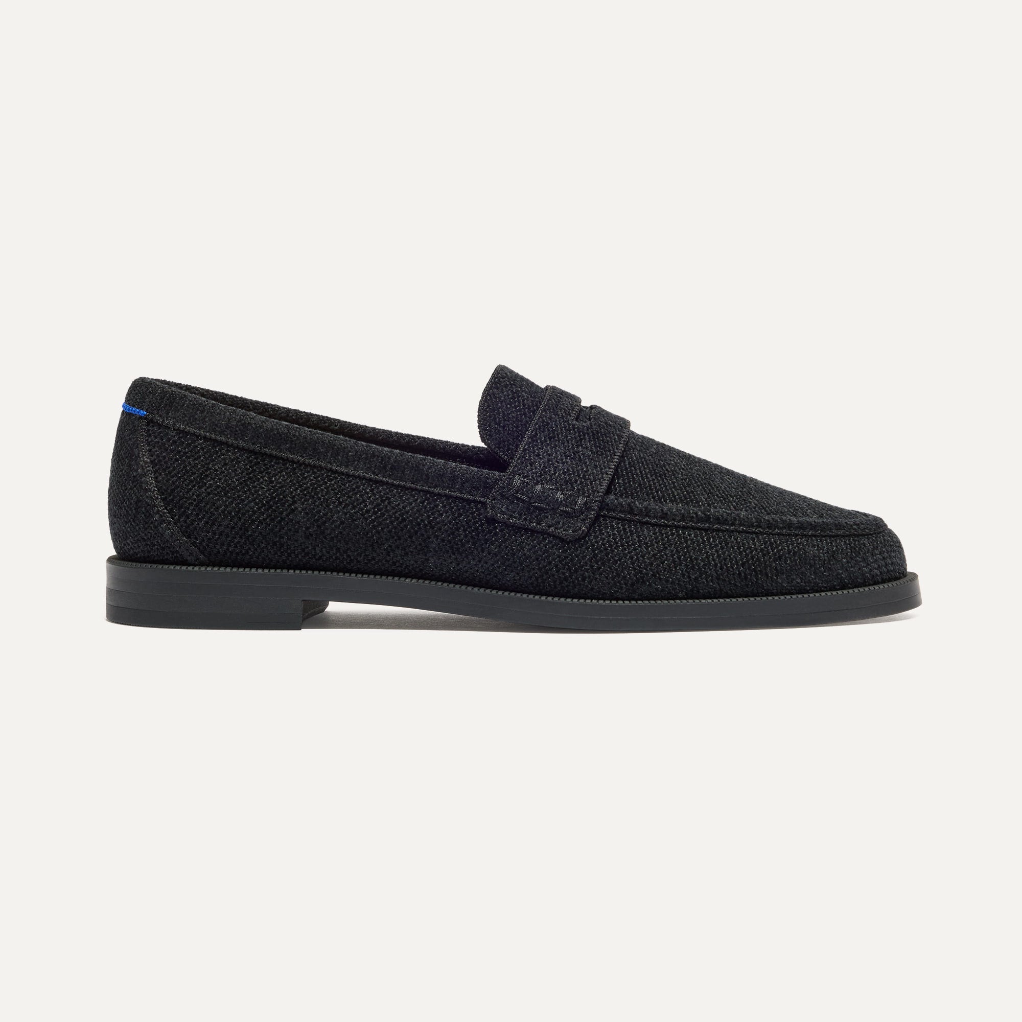The Penny Loafer in ReVelvet™ Black shown from the side.