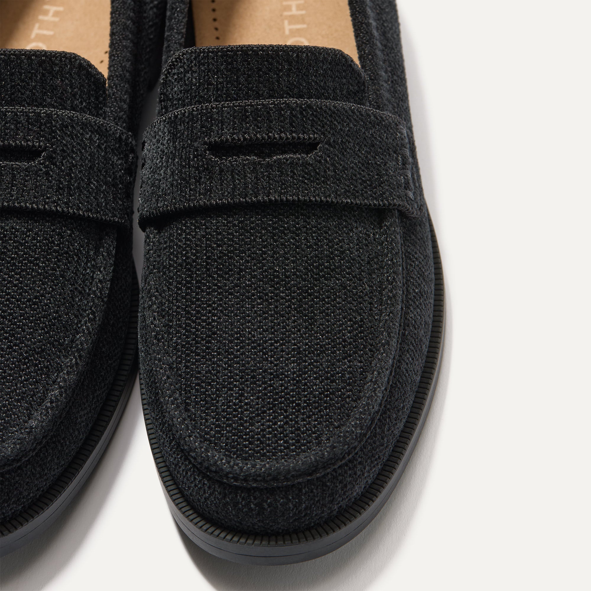 Close up of the toe box and penny keeper of The Penny Loafer in ReVelvet™ Black.