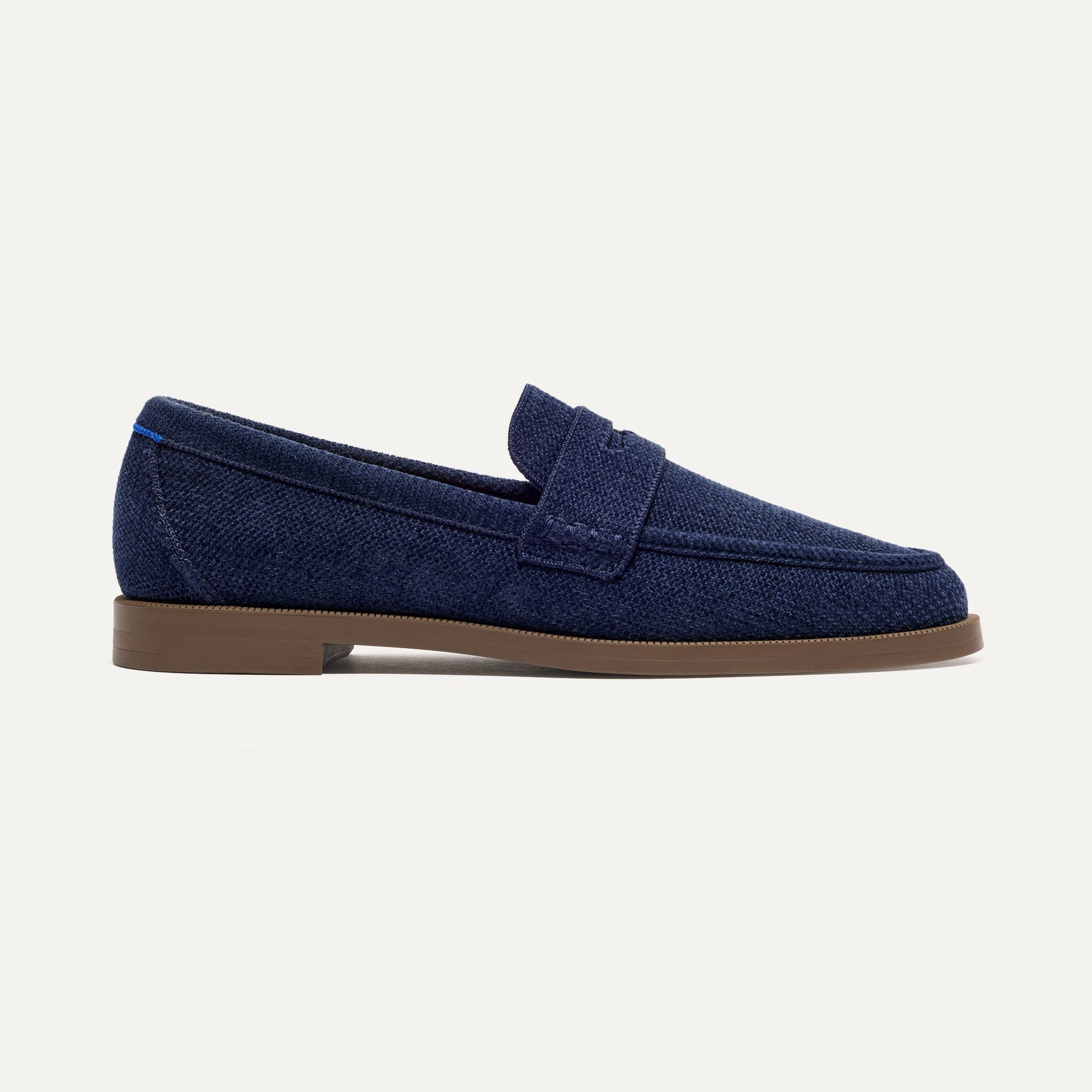 The Penny Loafer in ReVelvet™ Navy shown from the side.