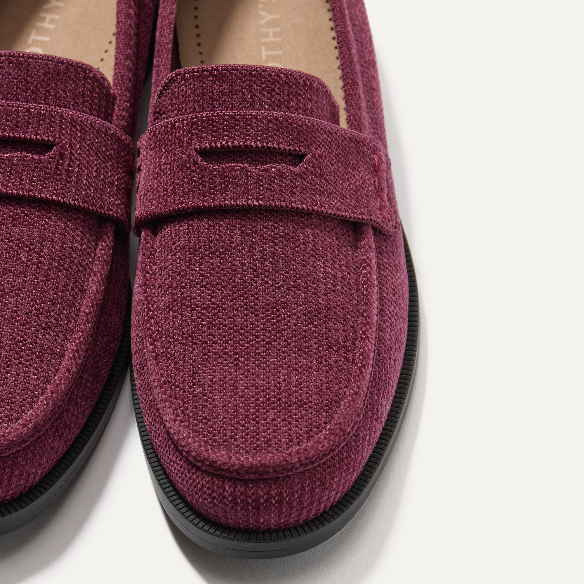 Close up of the toe box and penny keeper of The Penny Loafer in ReVelvet™ Syrah.