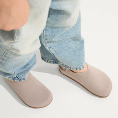 hover | A child wearing The Kids Clog in Dove.