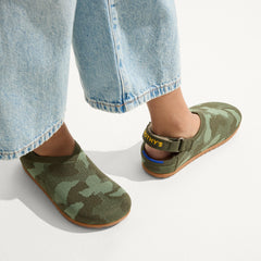hover | A child wearing The Kids Clog in Green Camo.
