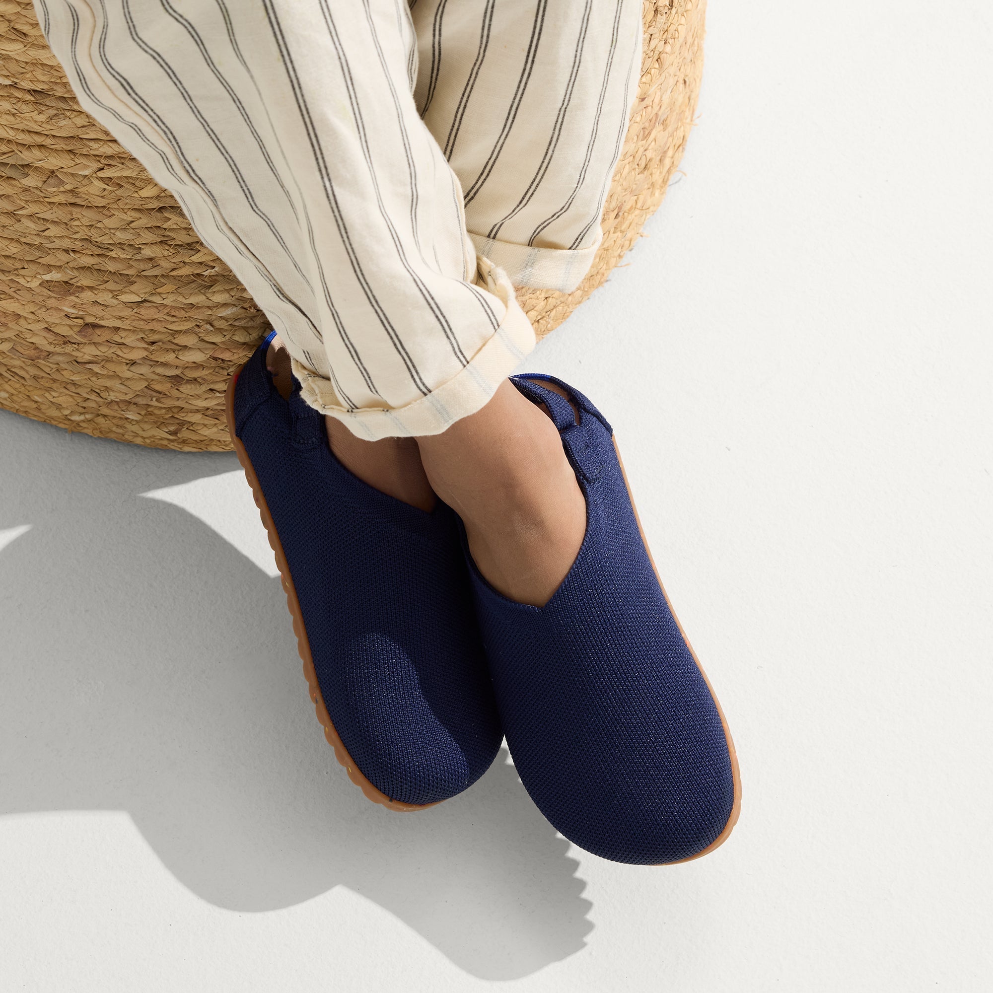 hover | A child wearing The Kids Clog in Midnight Confetti.