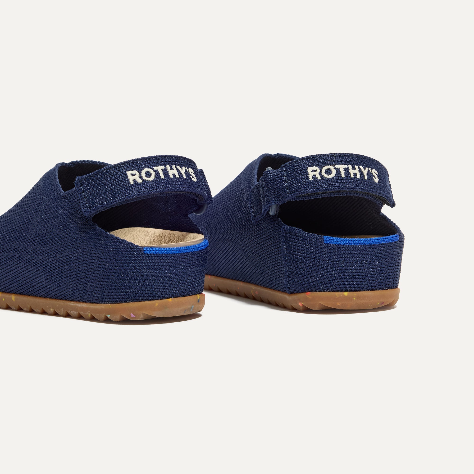 Close up of the heel of The Kids Clog in Midnight Confetti, with Rothy's signature blue halo. 