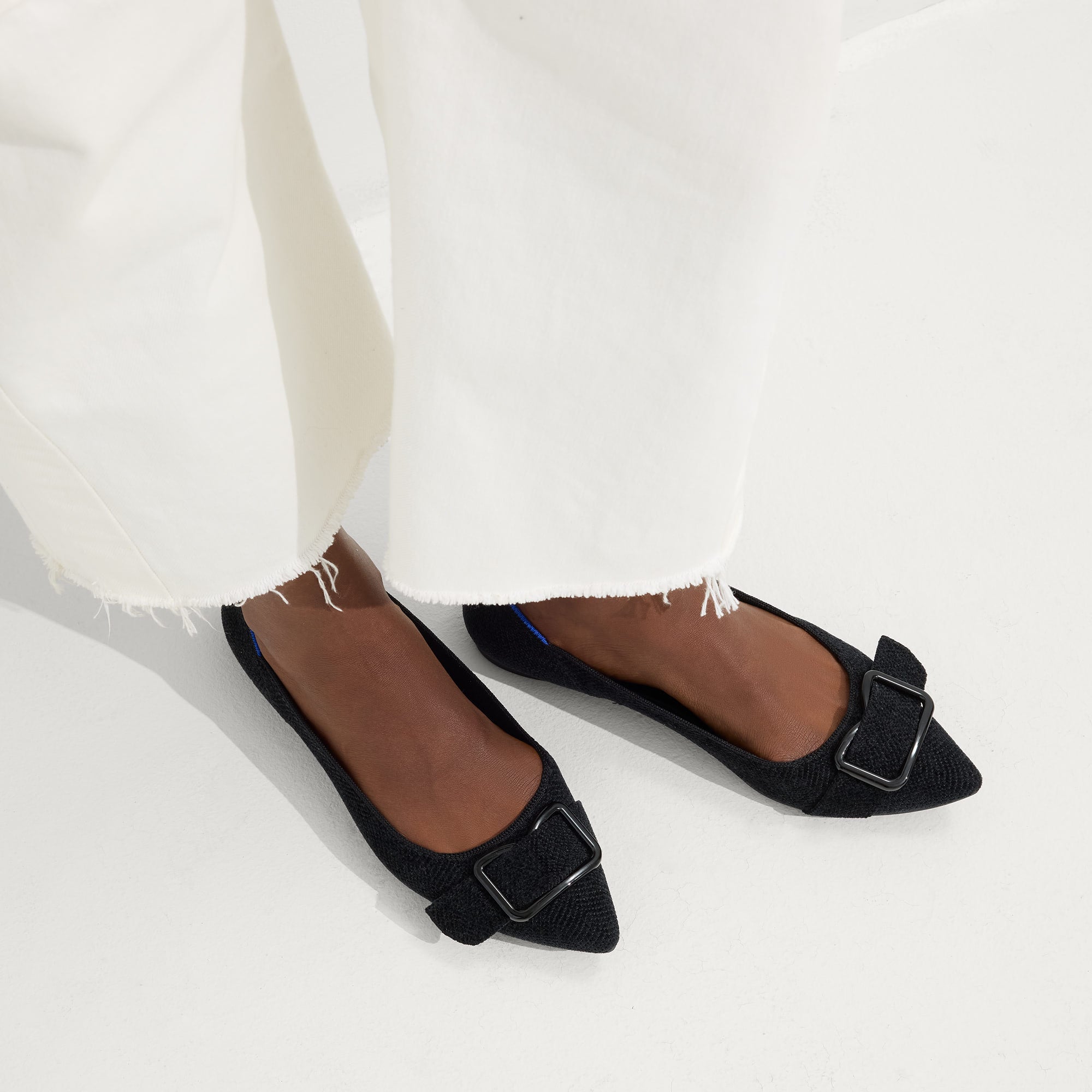 hover | Model wearing The Emblem Point II in ReVelvet™ Black.