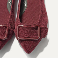 Close up of the hardware detail of The Emblem Point II in ReVelvet™ Syrah.