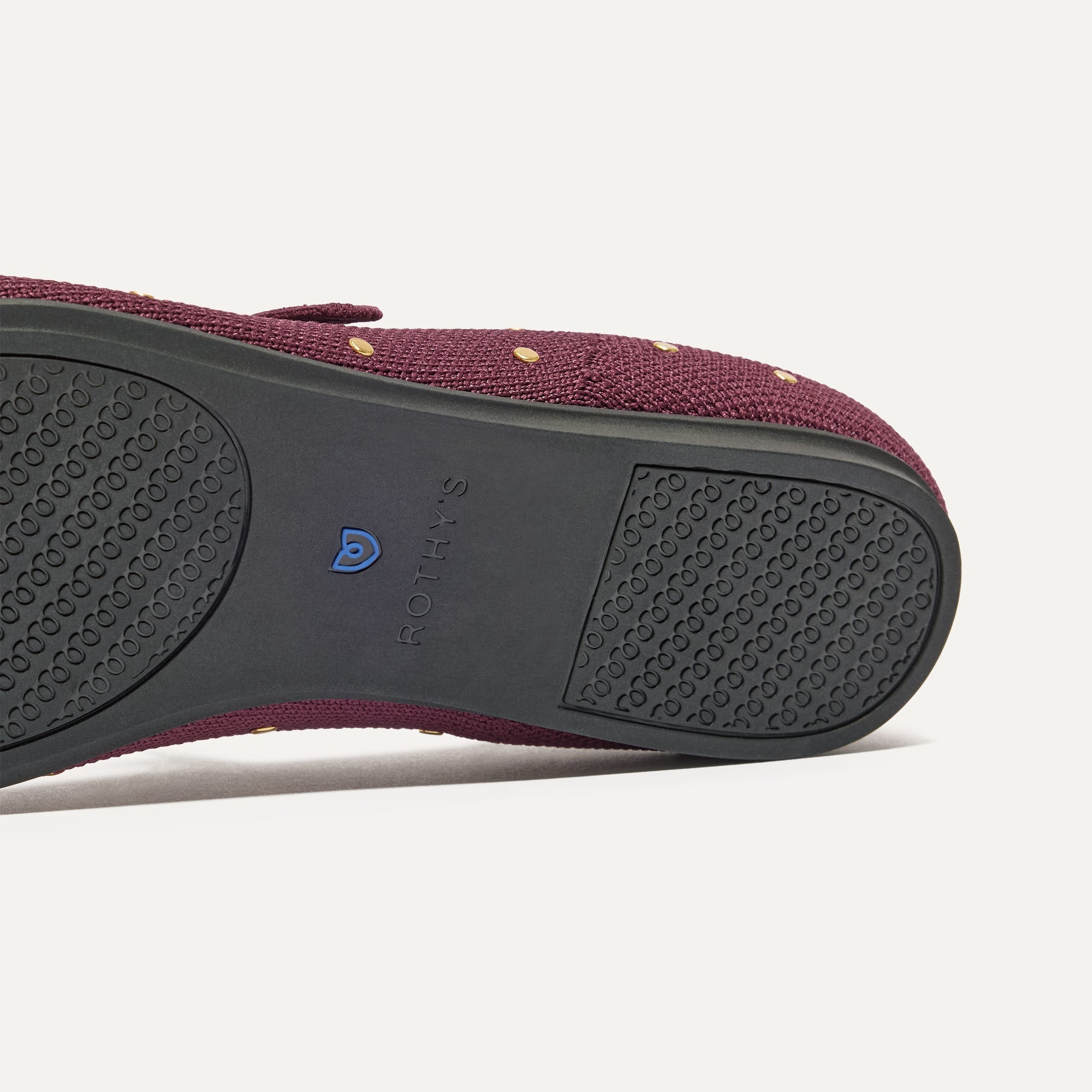 The sole of The Square Mary Jane in Studded Syrah shown in diagonal view.