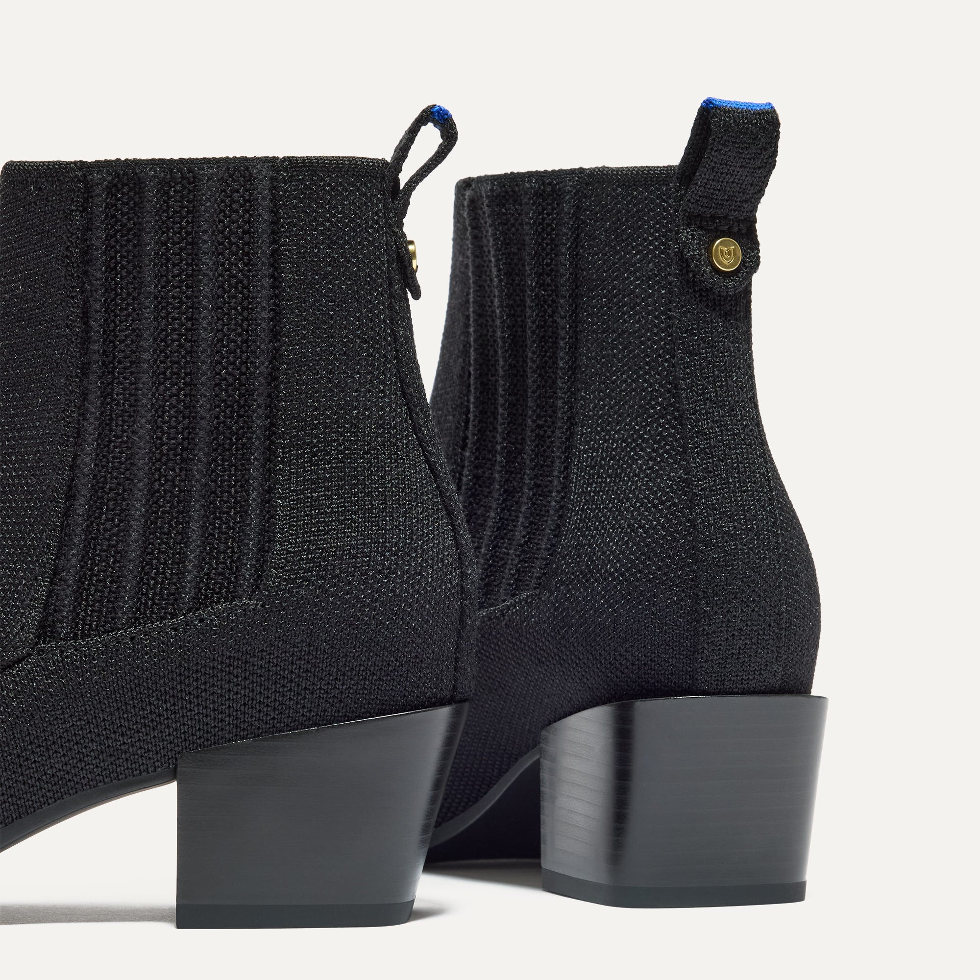 Close up of the block heel of The Western Bootie in Black.
