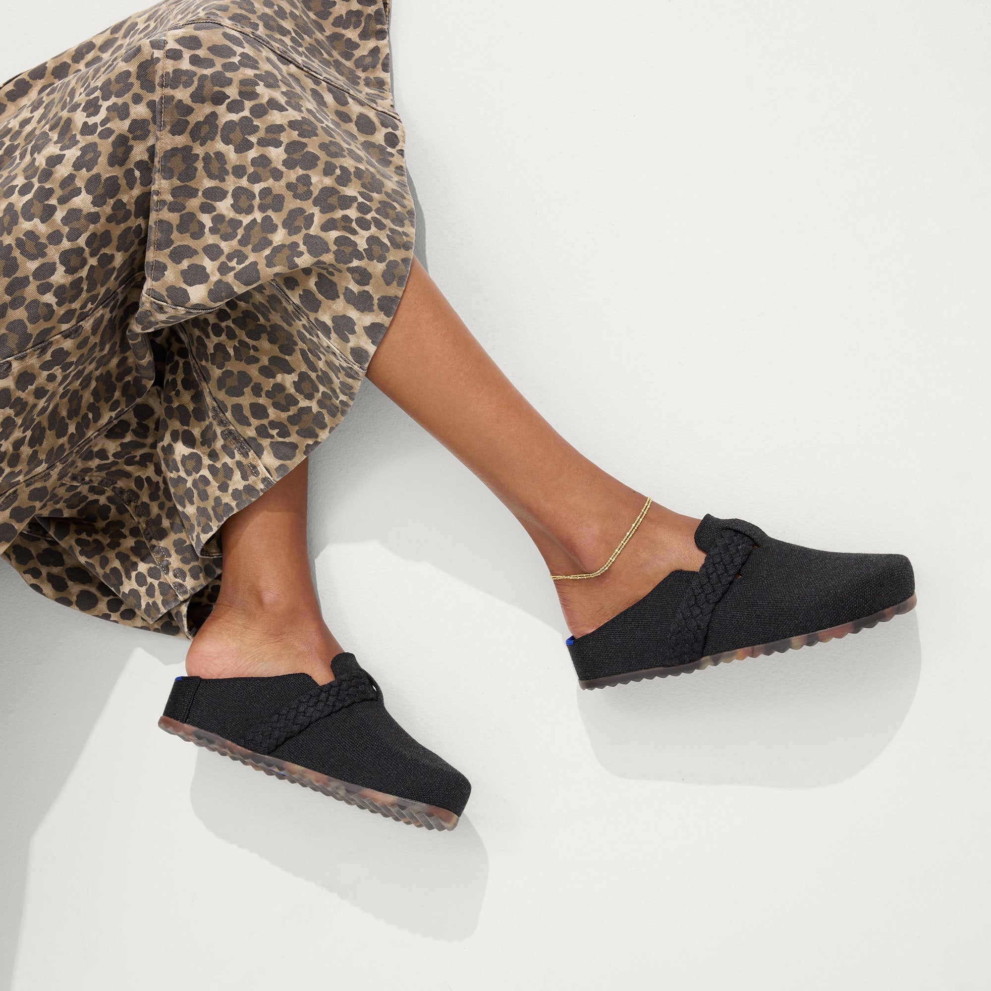 hover | Model wearing The Braid Clog in Black.