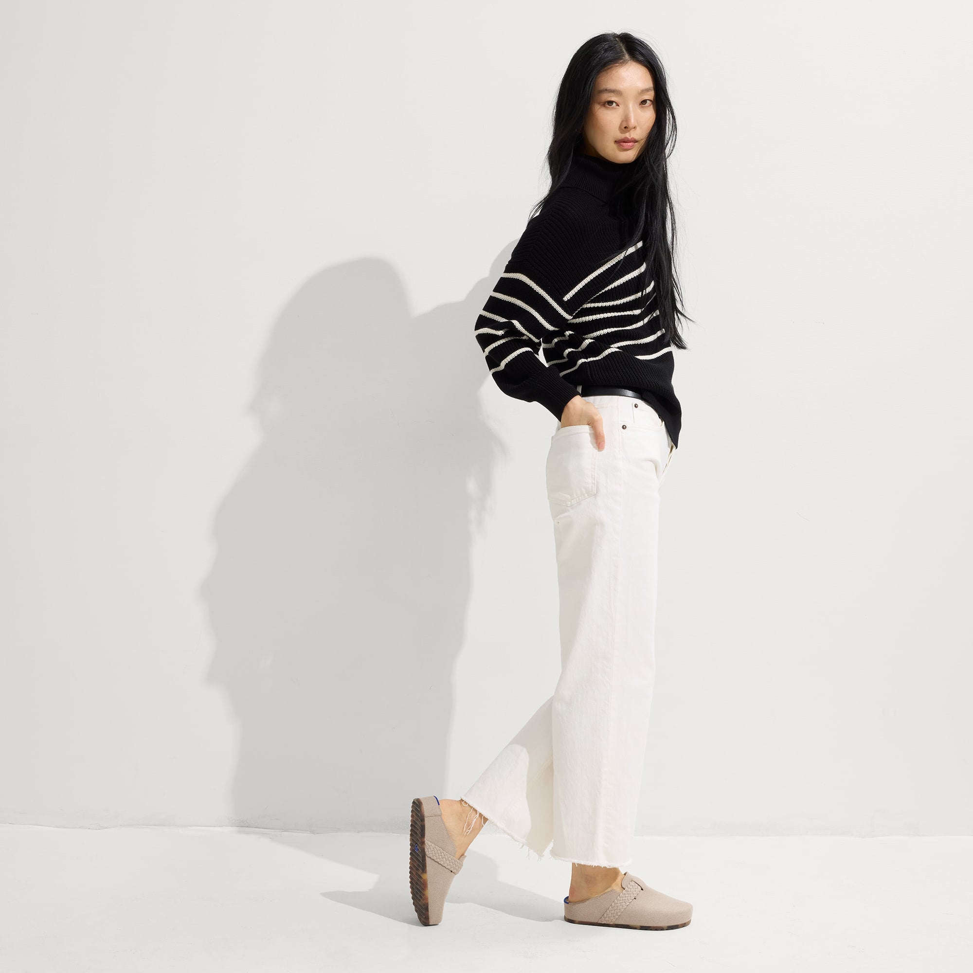 Alternate view of a model wearing The Braid Clog in Dove.