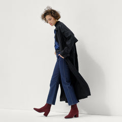 Alternate view of a model wearing The High Classic Boot in ReVelvet™ Syrah.