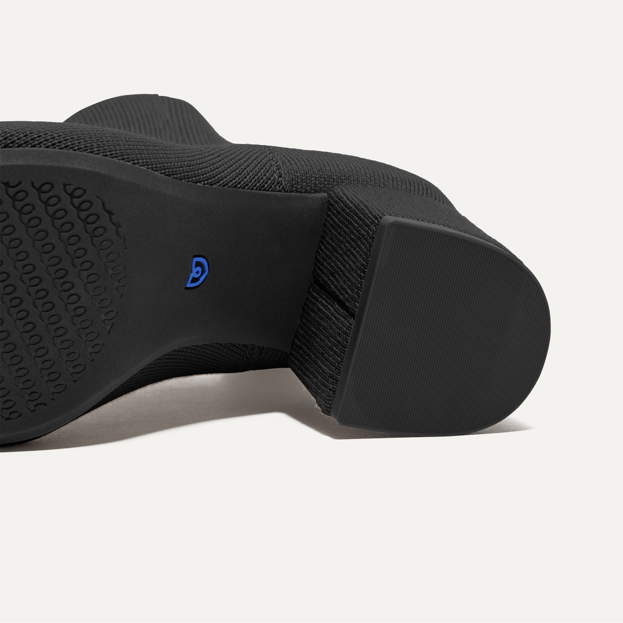 Close up of the outsoles of The High Classic Boot in Black.