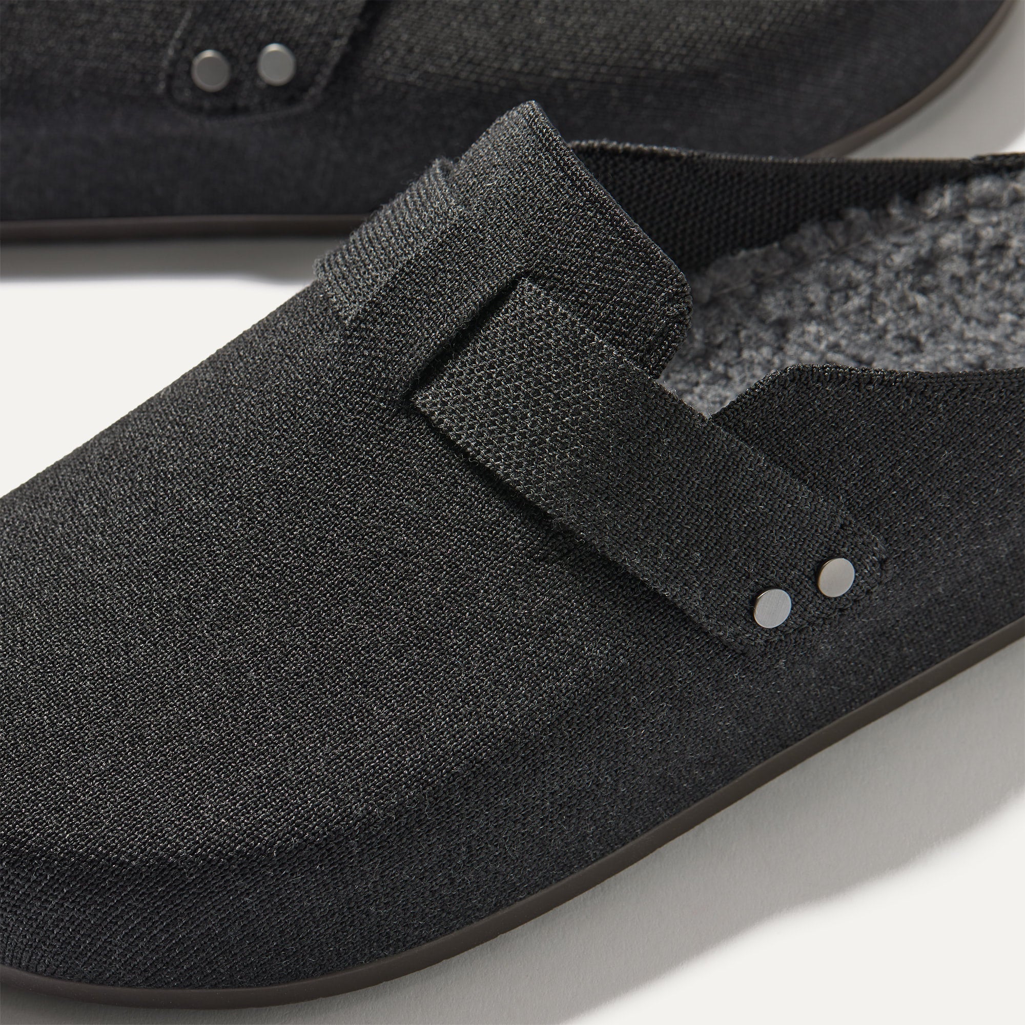 Close up of the toe and vamp of The Men's Cozy Clog in Black.