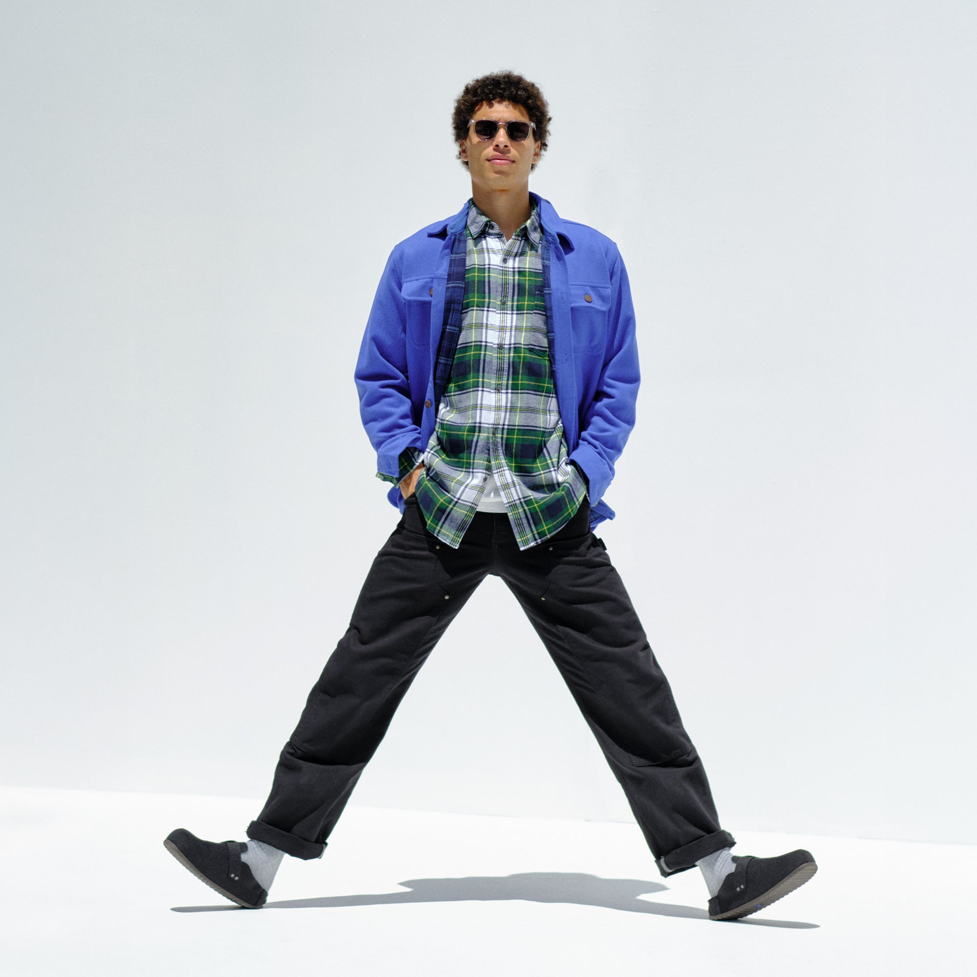 Alternate view of a model wearing The Men's Cozy Clog in Black.