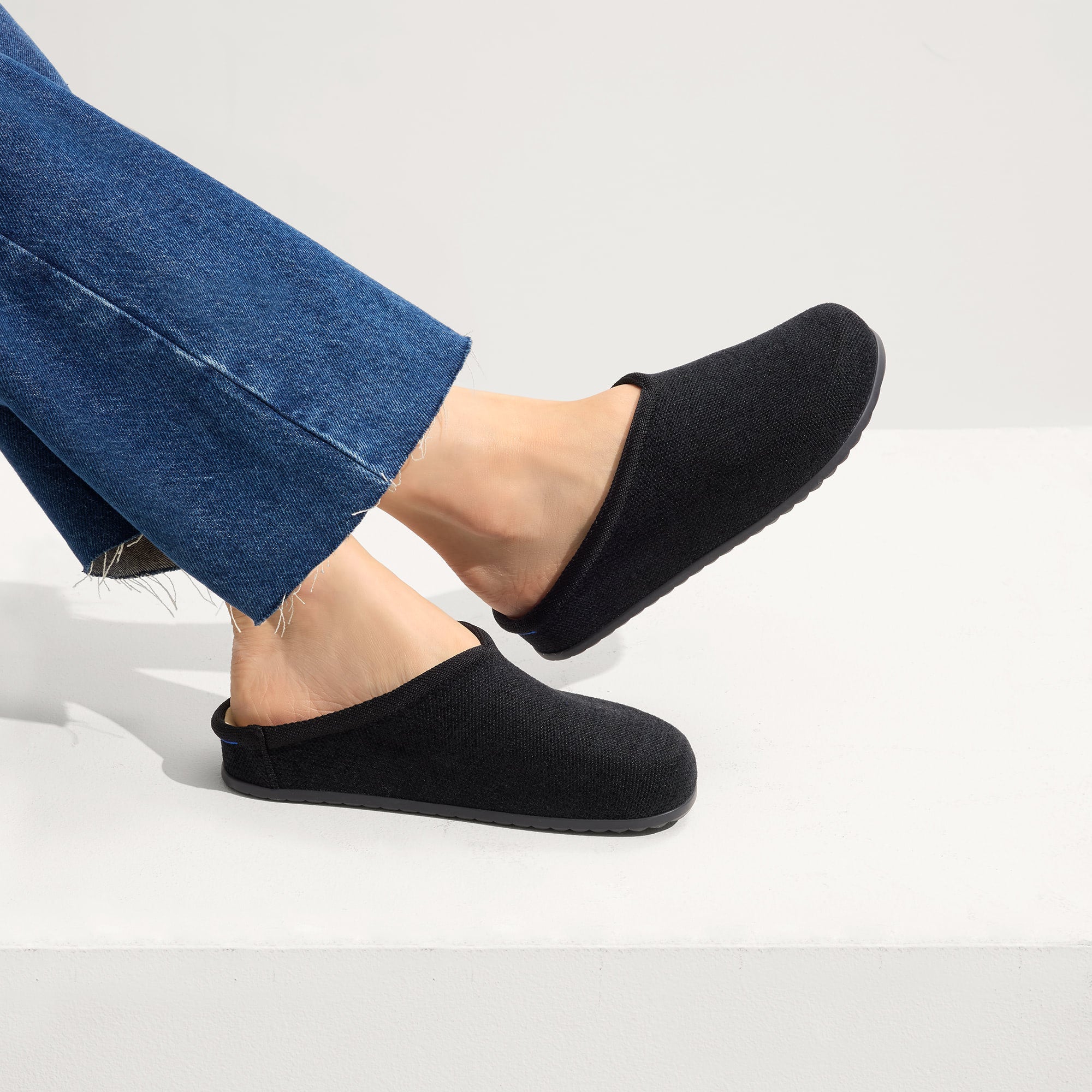 hover | Model wearing The Casual Clog in ReVelvet™ Black.