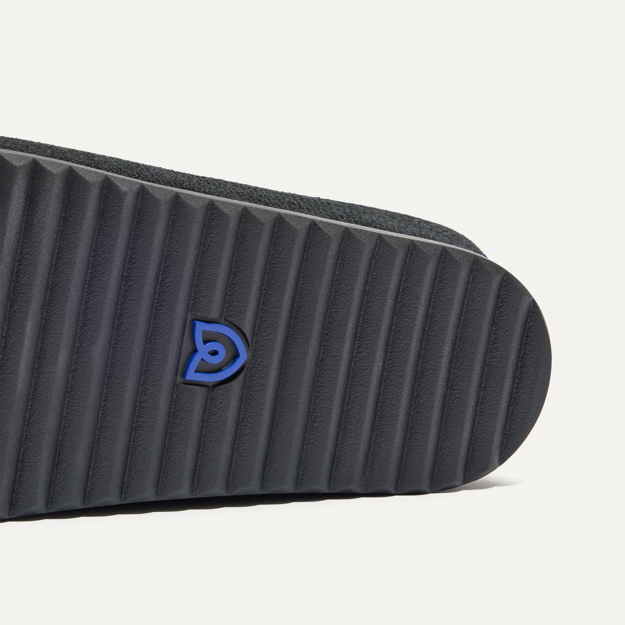 Close up of the outsoles of The Casual Clog in ReVelvet™ Black.