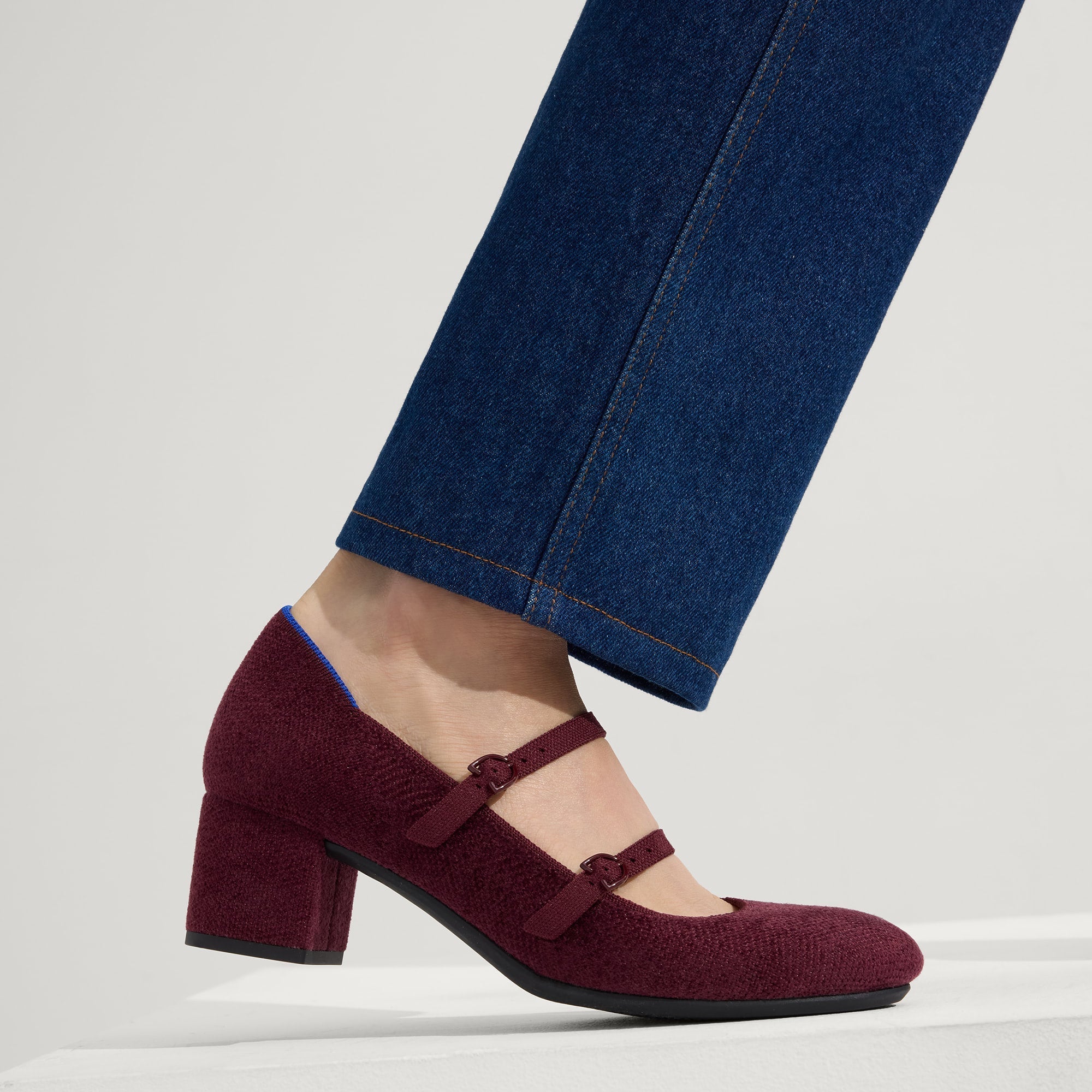 hover | Model wearing The Double Buckle Mary Jane Heel in ReVelvet™ Syrah.