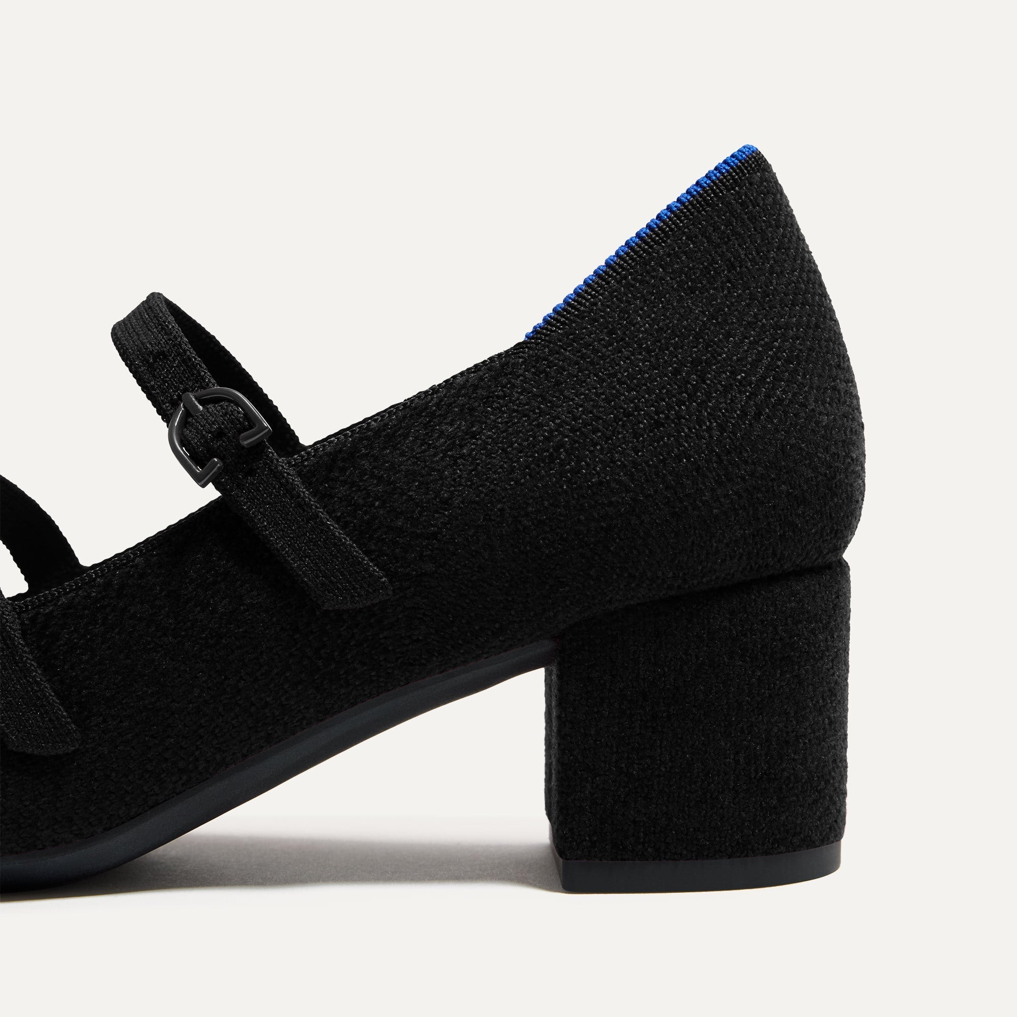 Closeup of the heel on The Double Buckle Mary Jane Heel in ReVelvet™ Black.