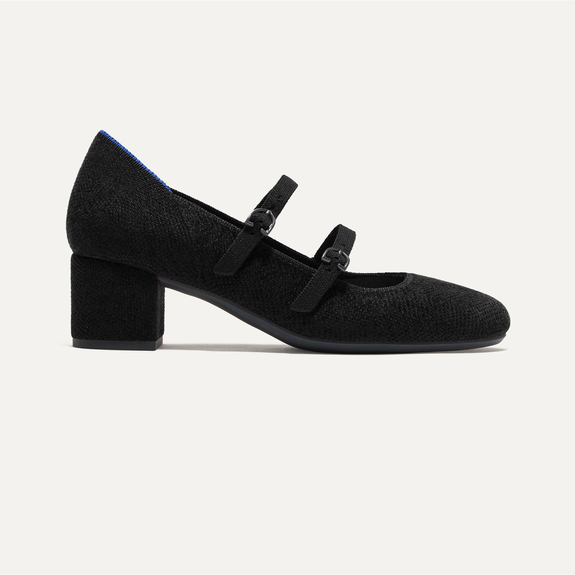 The Double Buckle Mary Jane Heel in ReVelvet™ Black shown from the side.
