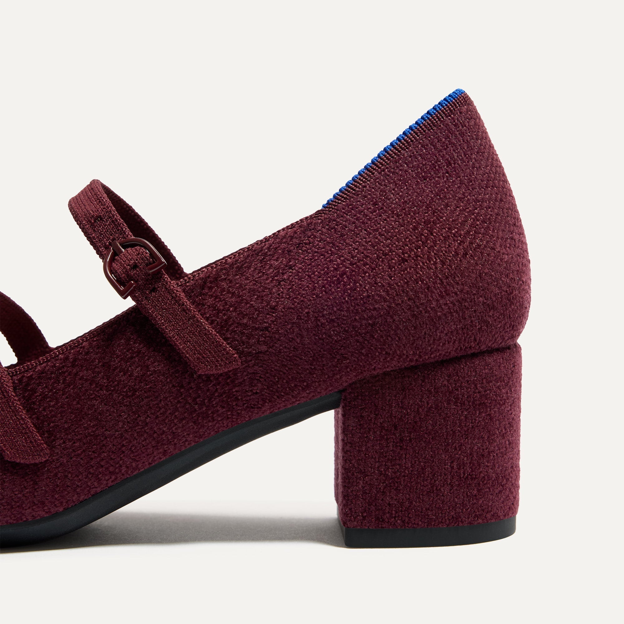 Close up of the heel on The Double Buckle Mary Jane Heel in ReVelvet™ Syrah.