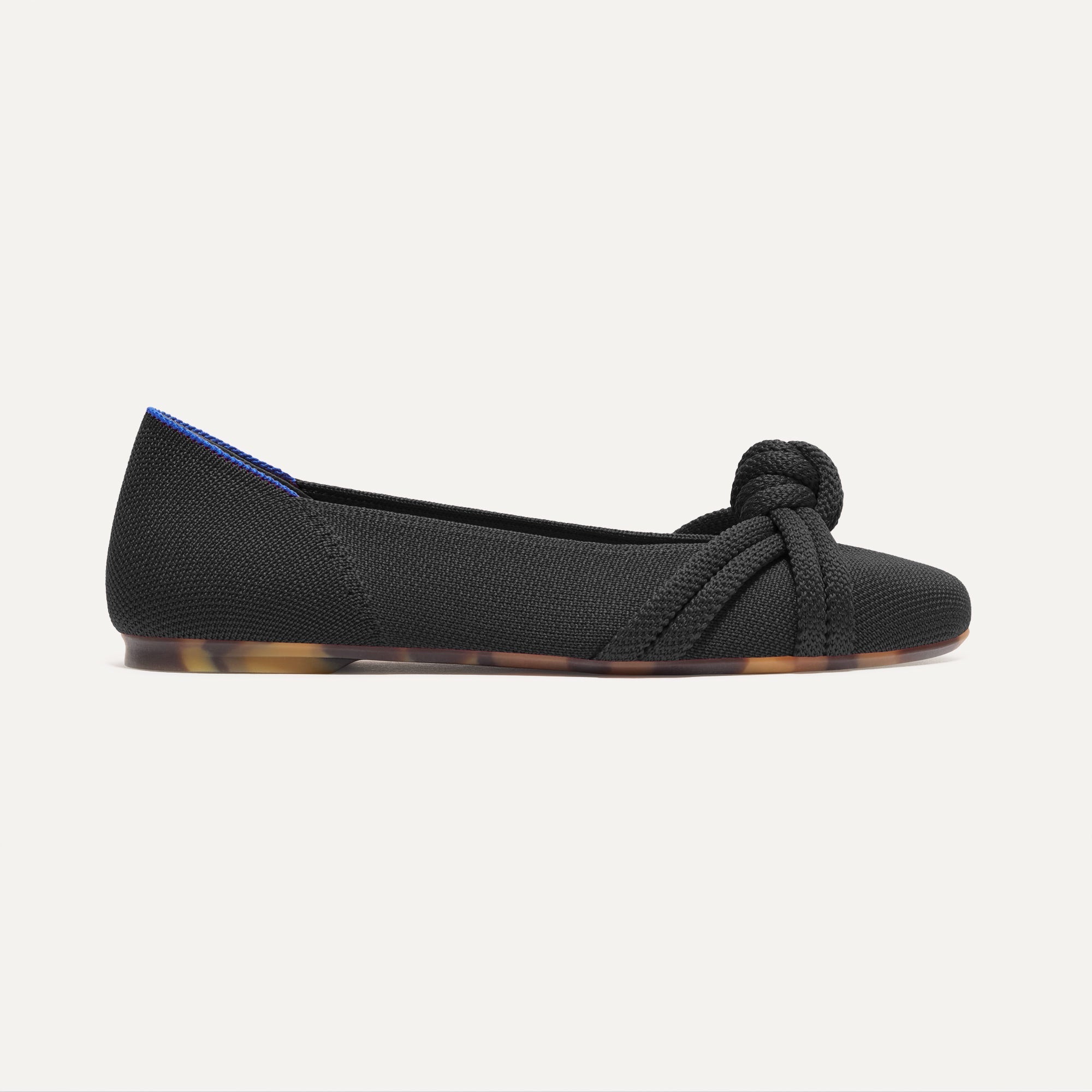 The Knot Ballet Flat in Black shown from the side.