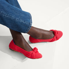 hover | Model wearing The Knot Ballet Flat in Lollipop Red.
