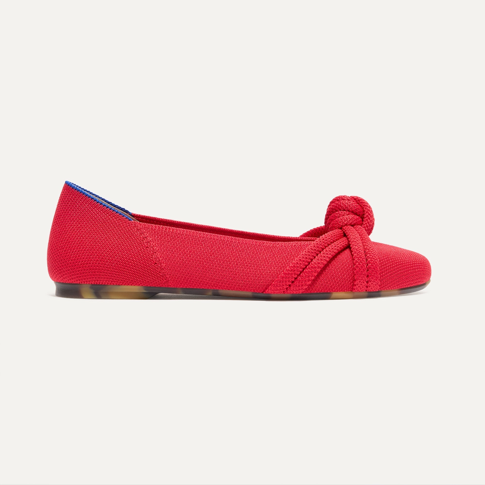 The Knot Ballet Flat in Lollipop Red shown from the side.