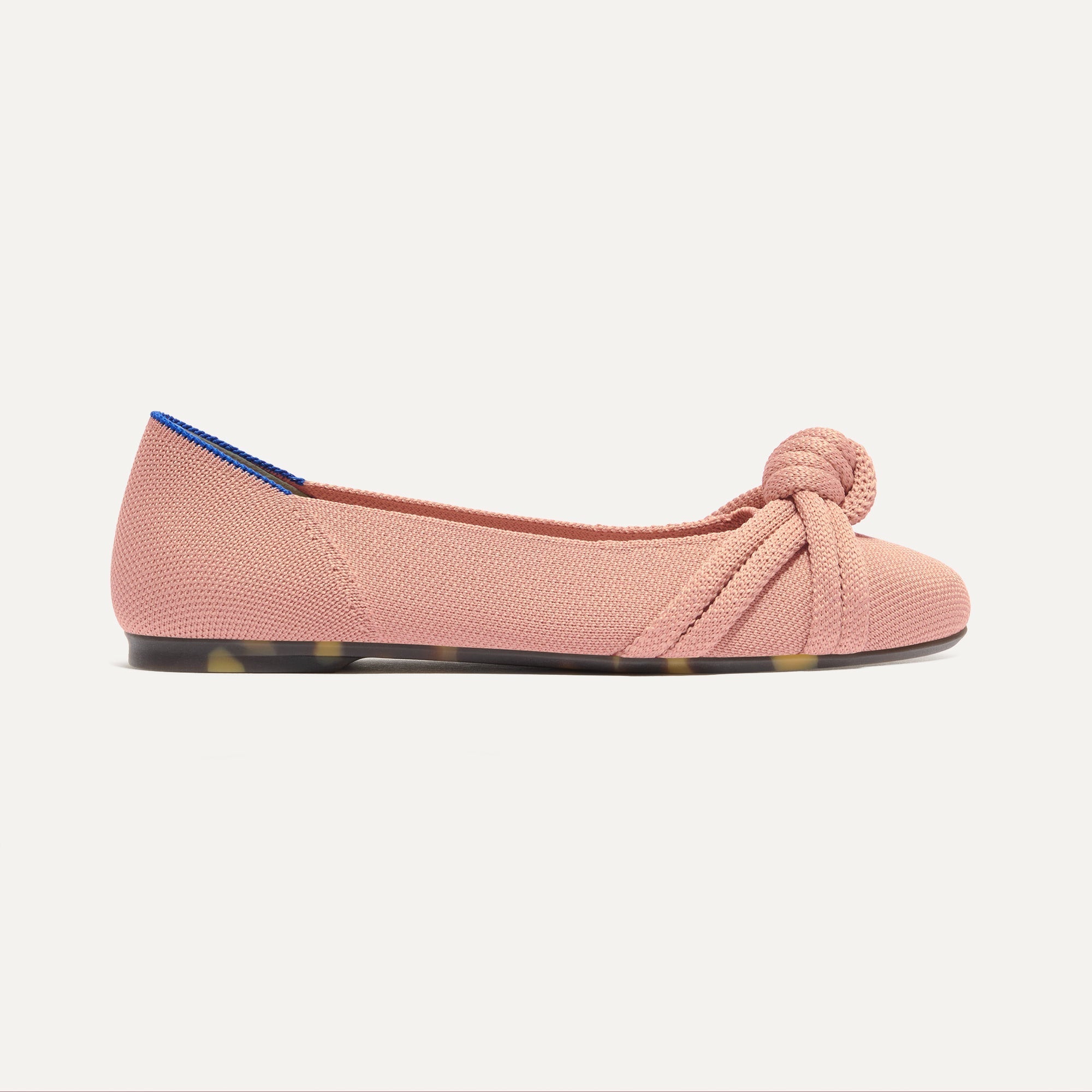 The Knot Ballet Flat in Peony shown from the side.
