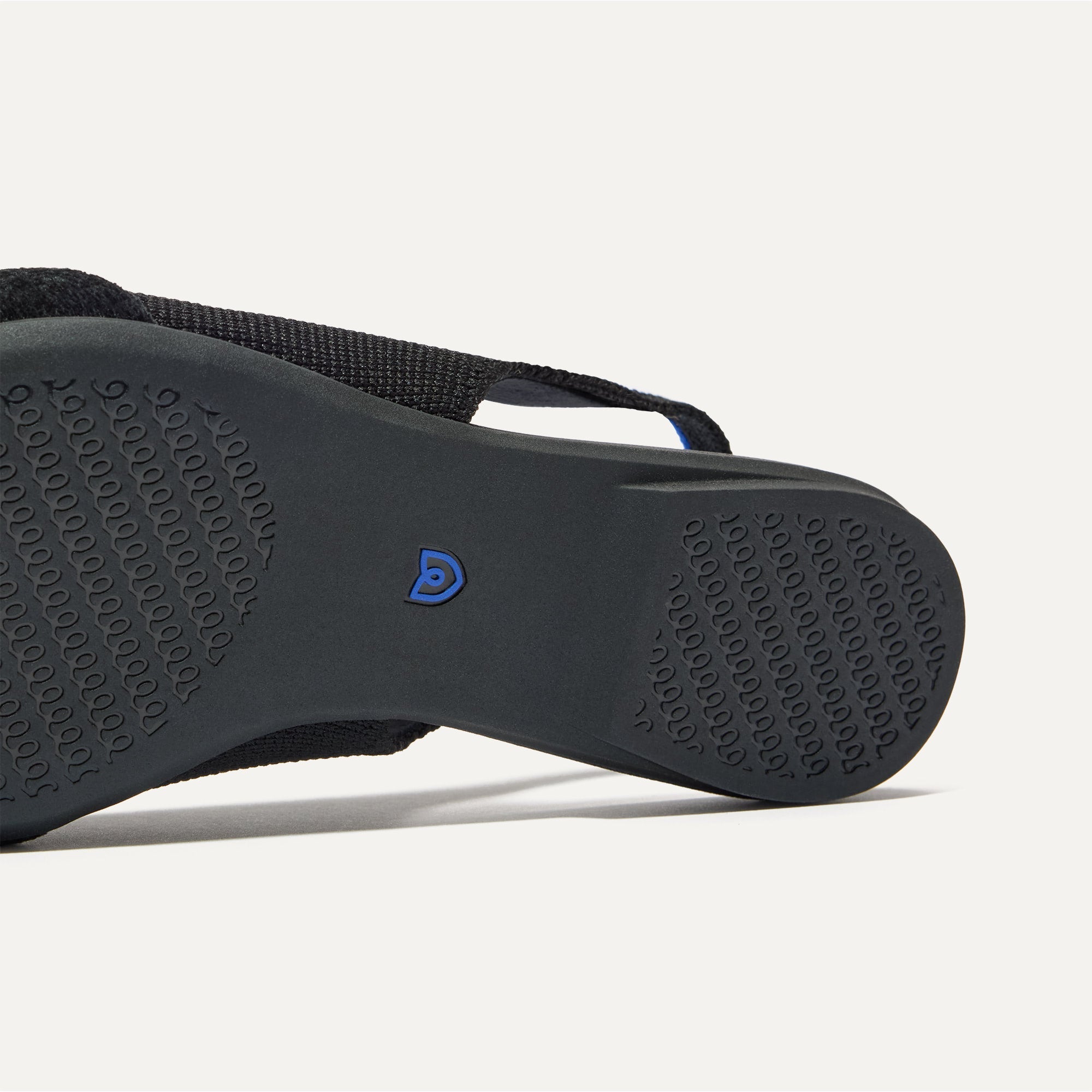 Close up of the outsole of The Twist Point Slingback in Black.