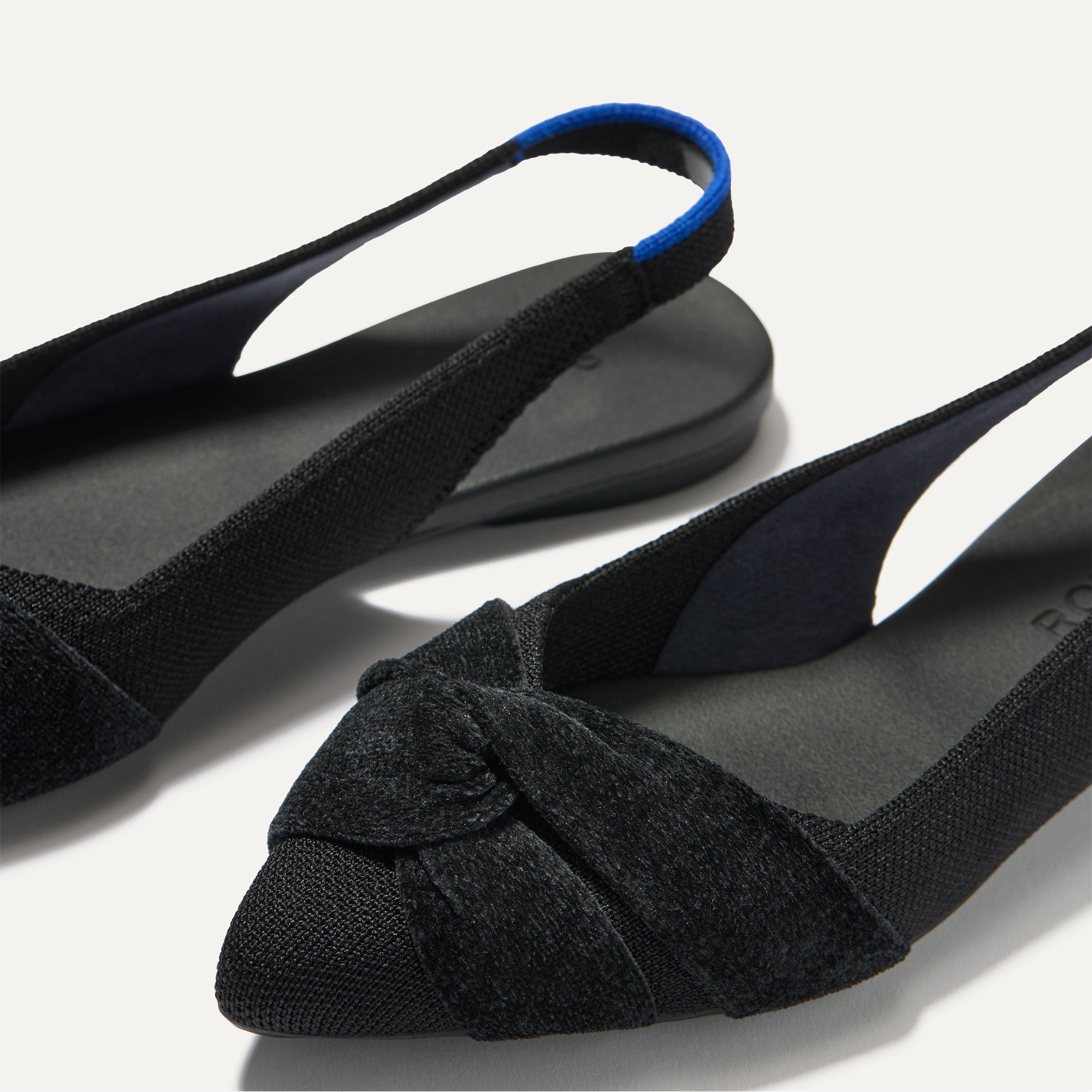 Close up of the toe and twist detail on The Twist Point Slingback in Black.
