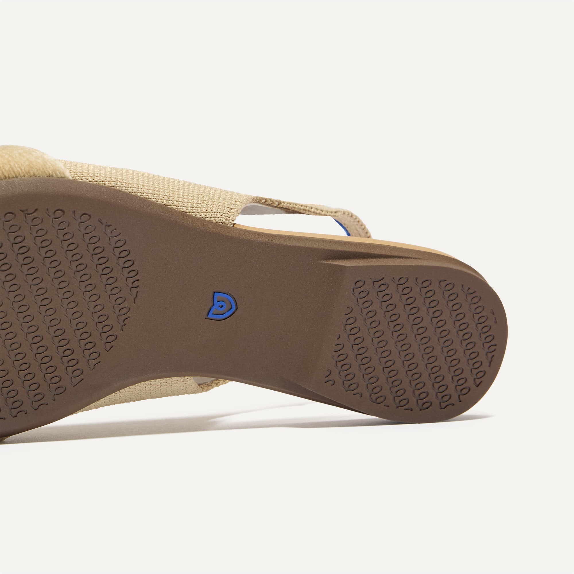 Close up of the outsole of The Twist Point Slingback in Brioche.