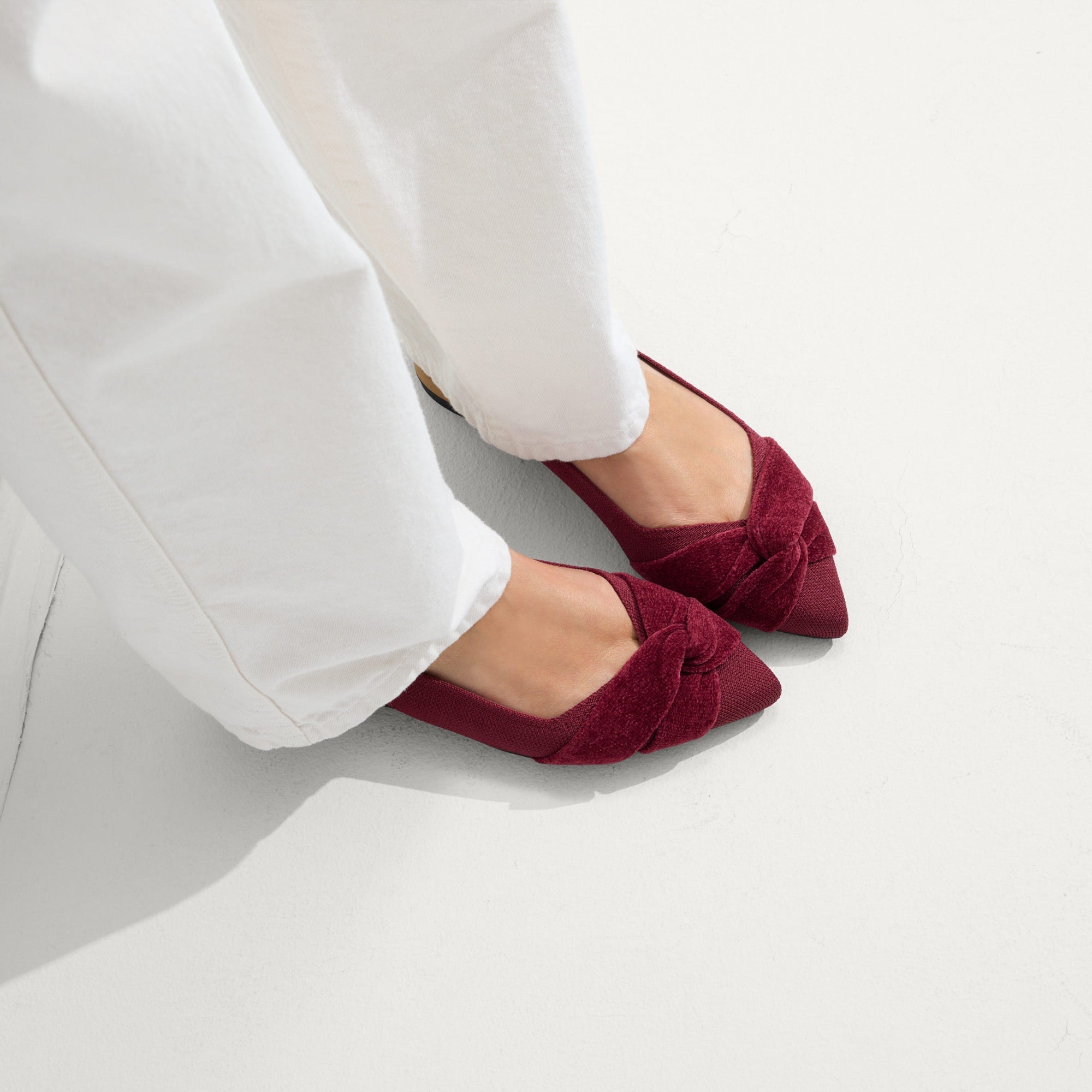 hover | Model wearing The Twist Point Slingback in Cabernet.